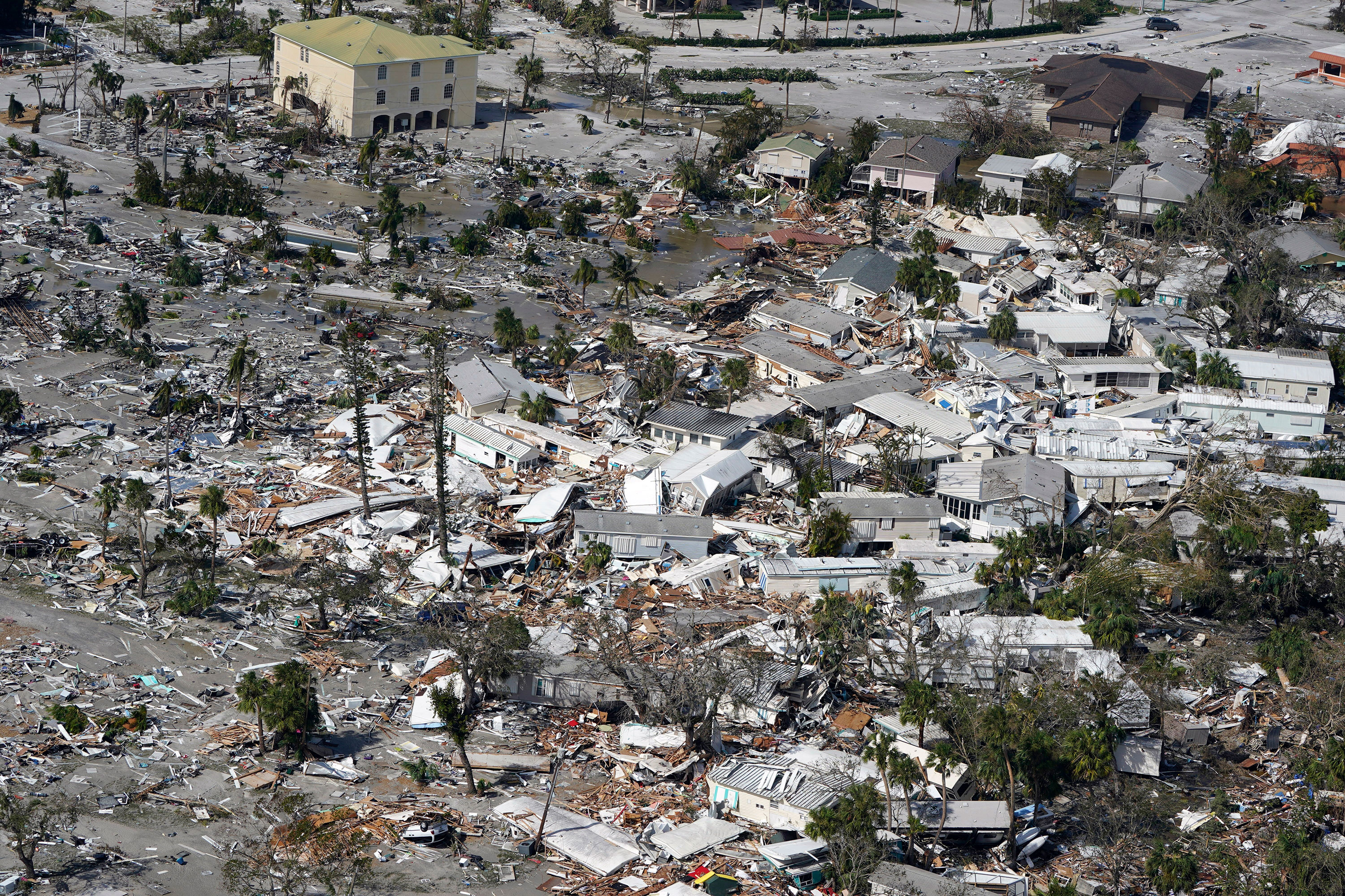 Damaged homes and debris are seen in Fort Myers Beach, Florida, on Thursday.