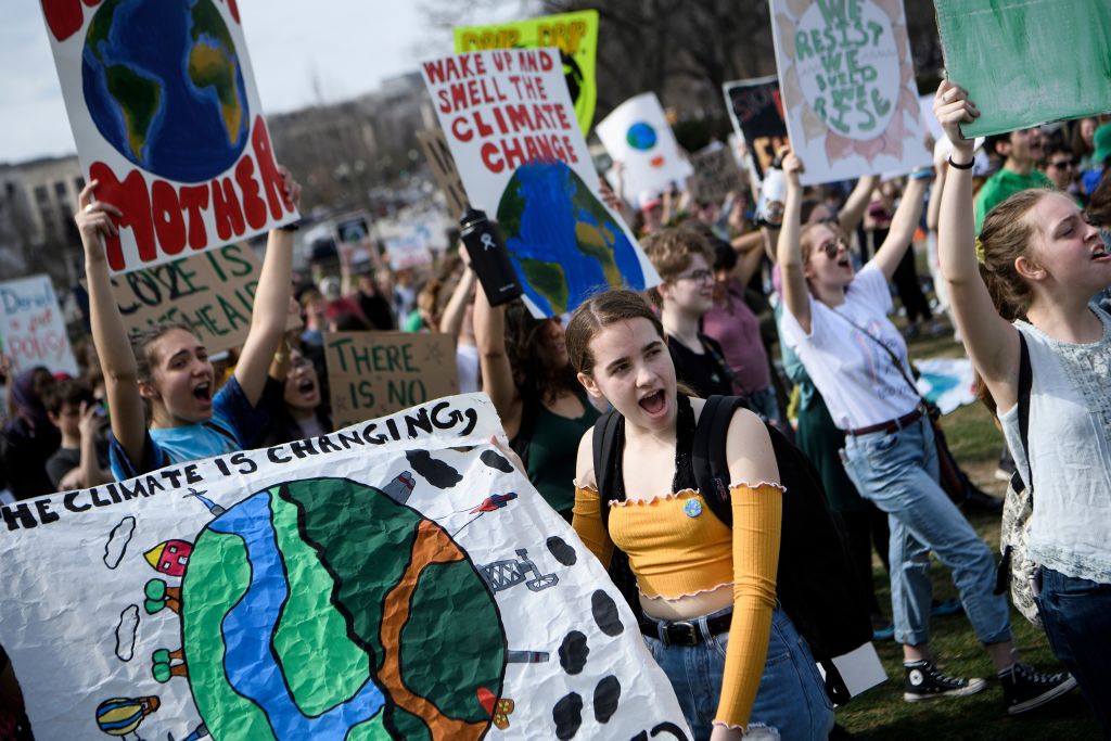 Activists listen during a youth climate rally on the west front of the US Capitol on March 15, 2019 in Washington, DC. 