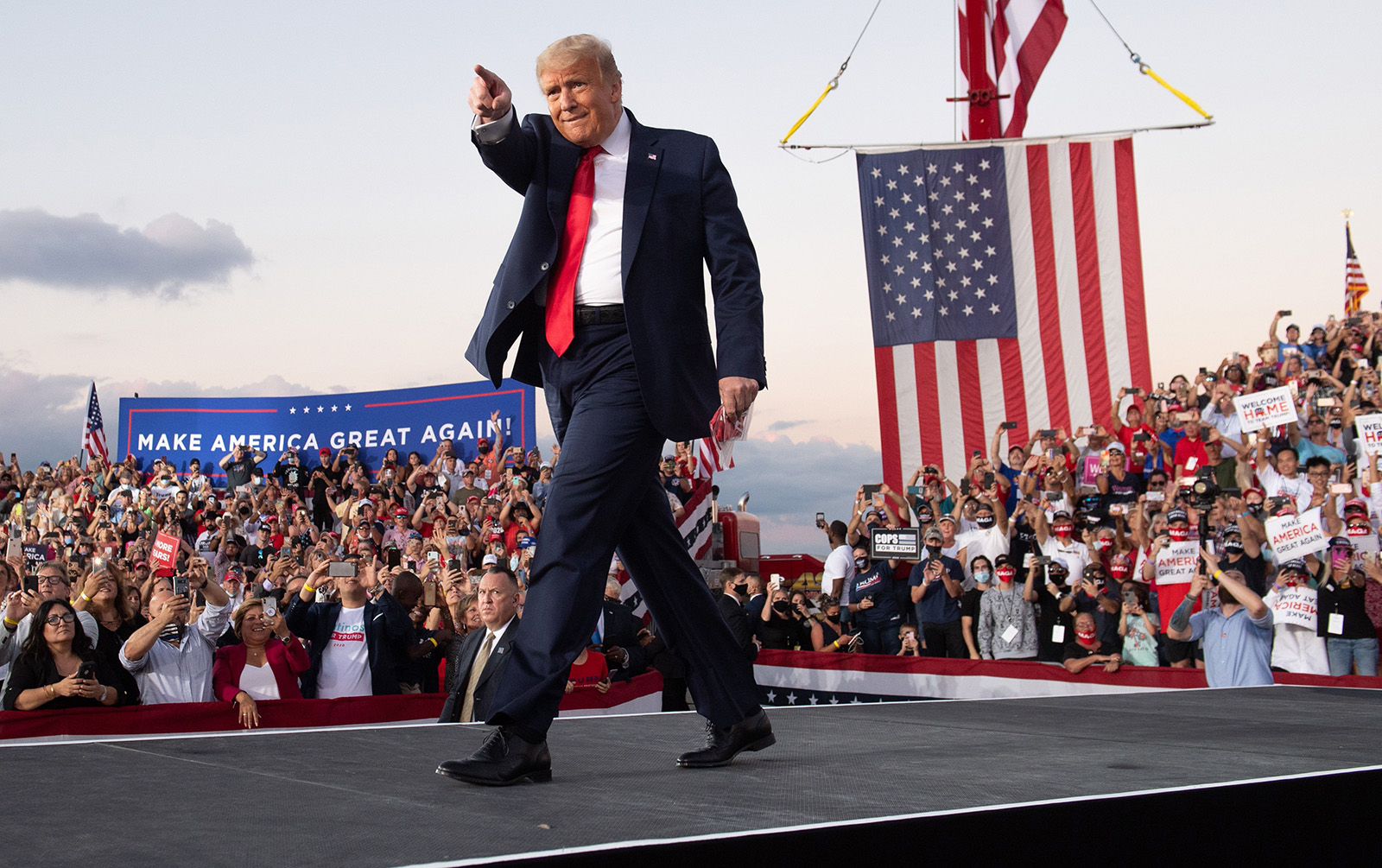 US President Donald Trump holds a Make America Great Again rally as he campaigns at Orlando Sanford International Airport in Sanford, Florida, on Monday, October 12. 