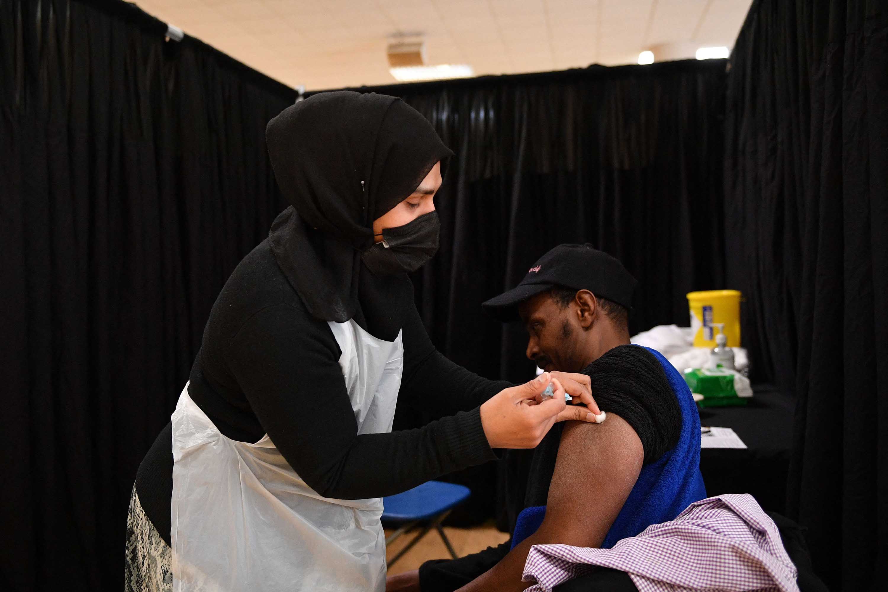 A man receives a dose of the AstraZeneca Covid-19 vaccine at a temporary vaccination center set up at the East London Mosque, in London, on April 14. 