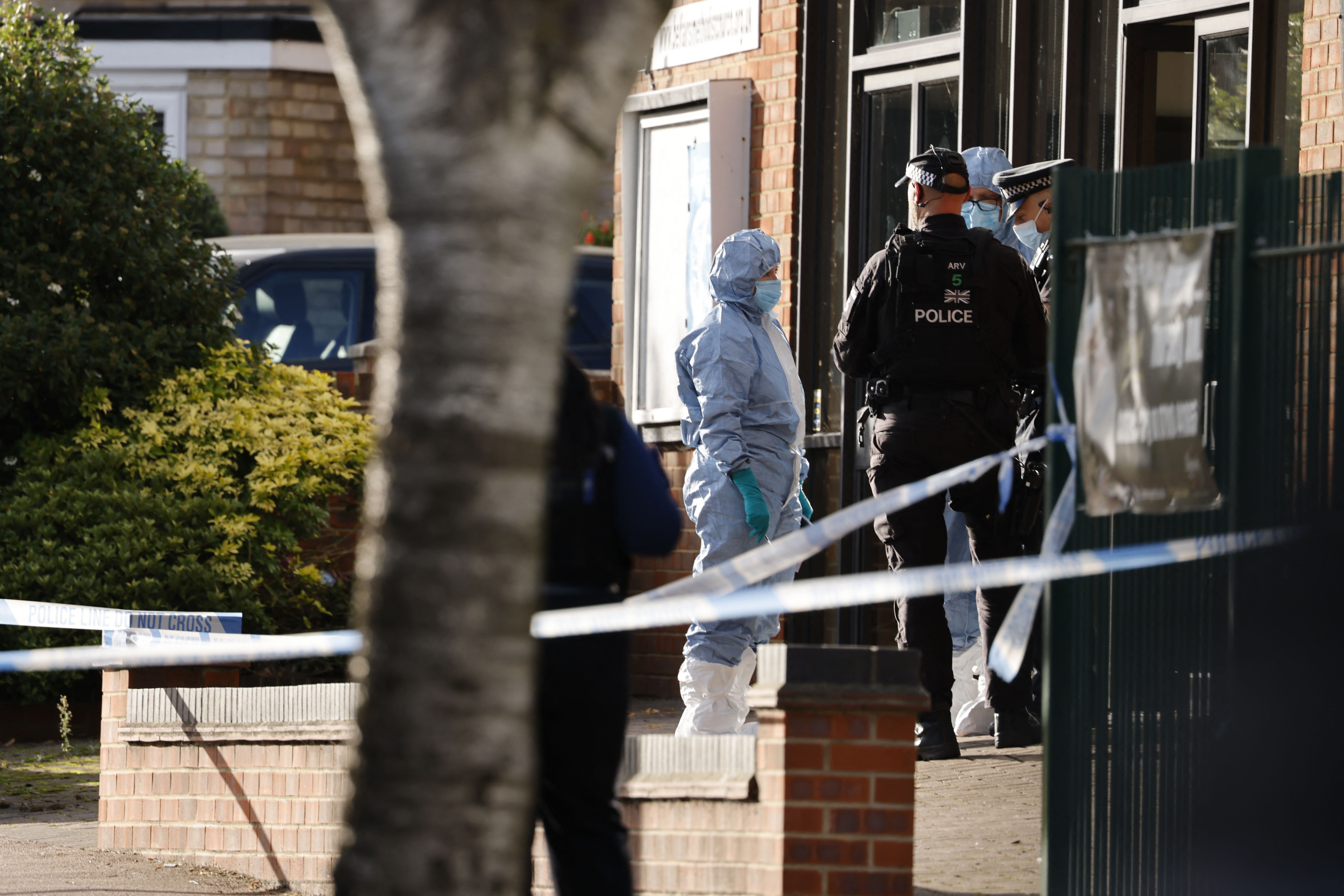 Police forensics officers work at the scene of a stabbing at Belfairs Methodist Church in Leigh-on-Sea, England, on October 15.