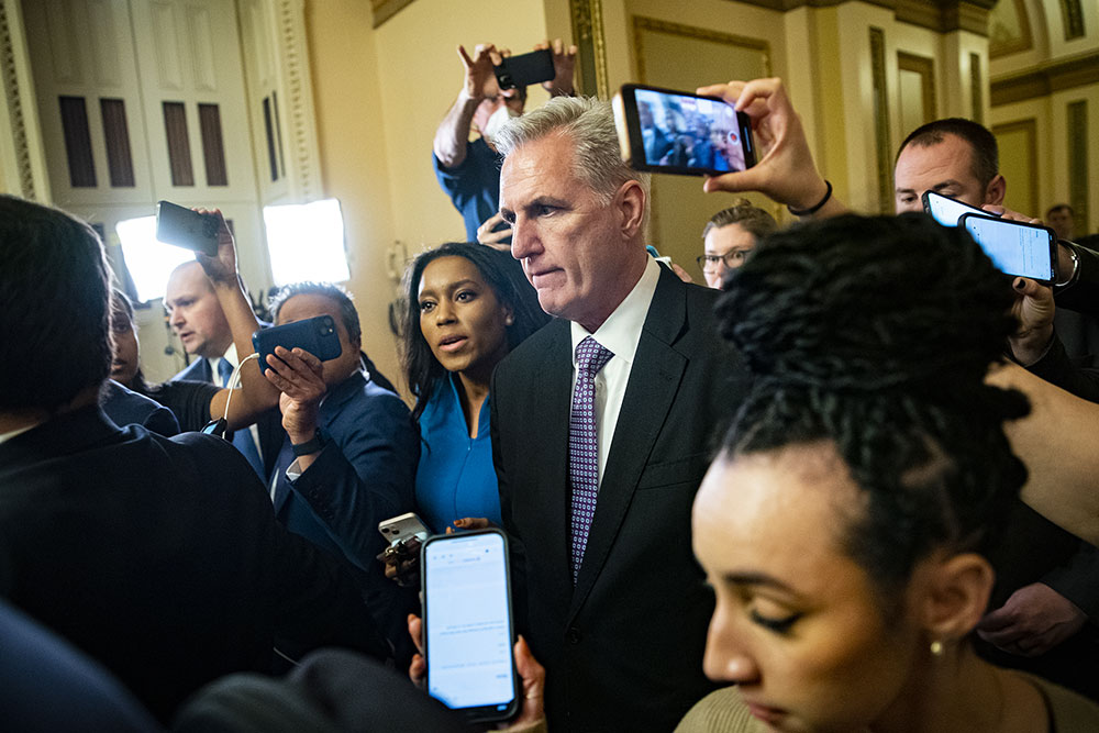 McCarthy speaks with members of the media as he departs the House Chamber on Wednesday, January 4.