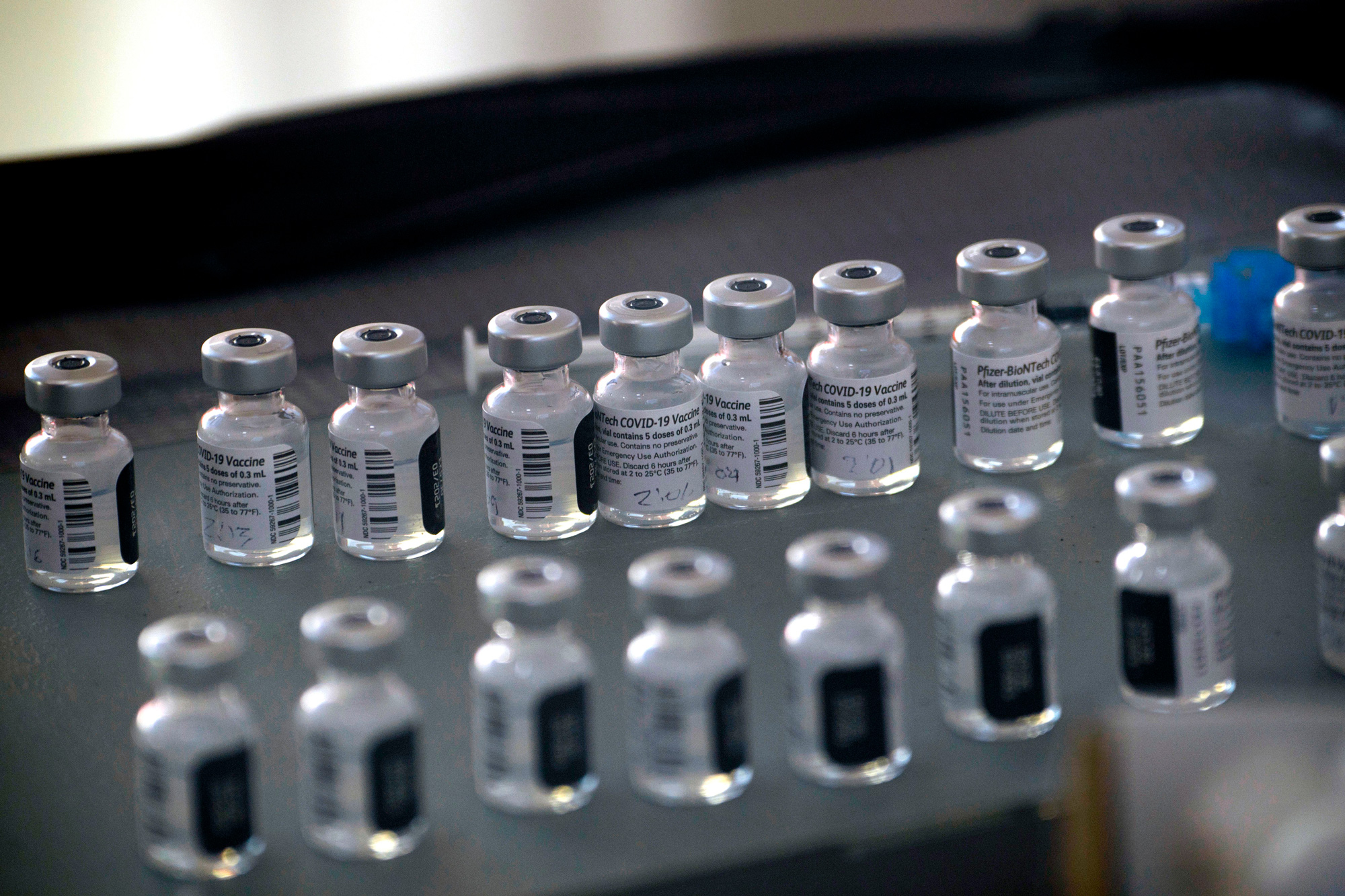 Vials of the Pfizer-BioNTech Covid-19 vaccine are prepared to be administered in Reno, Nevada on December 17, 2020. 