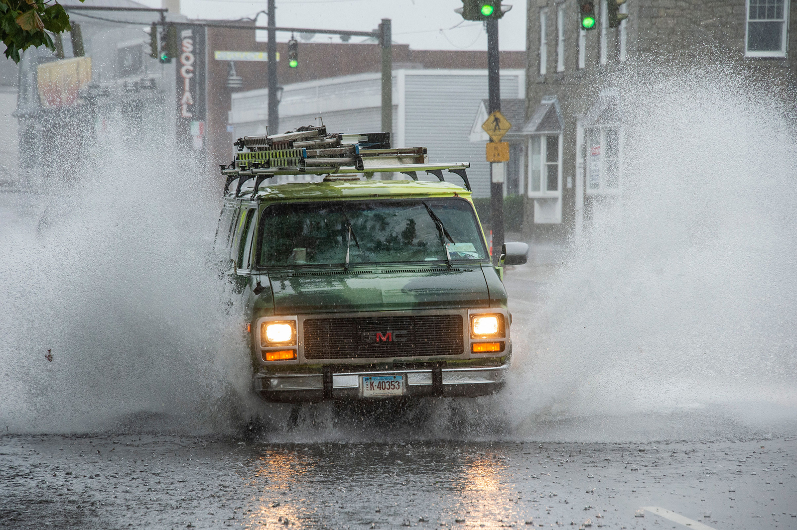 A van drives through a partially flooded street during Tropical Storm Henri in New London, Connecticut on August 22.