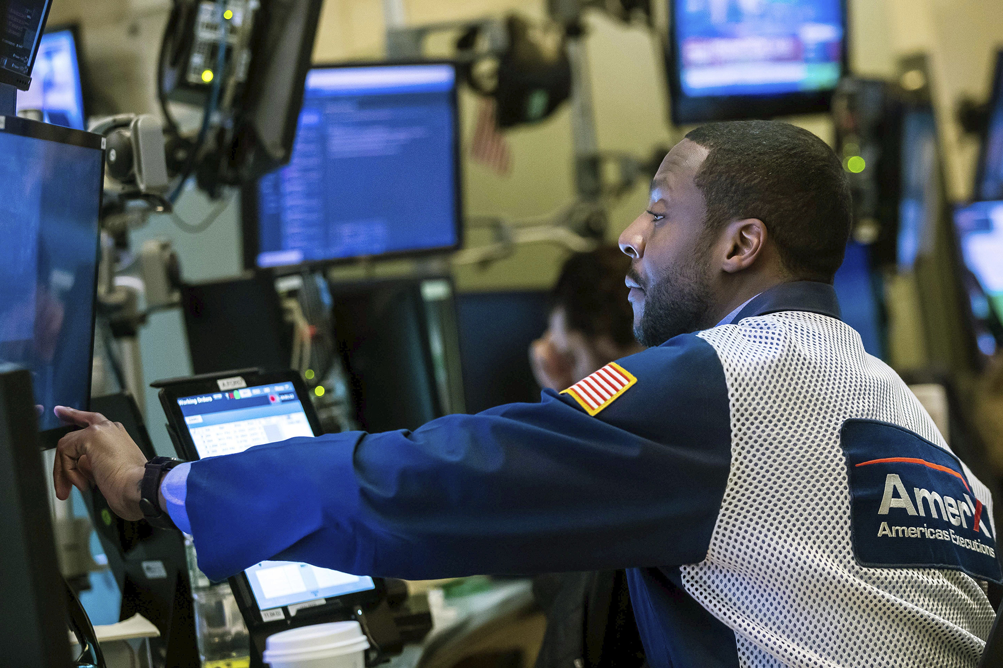 A trader works at the New York Stock Exchange on Friday, Feb. 25.