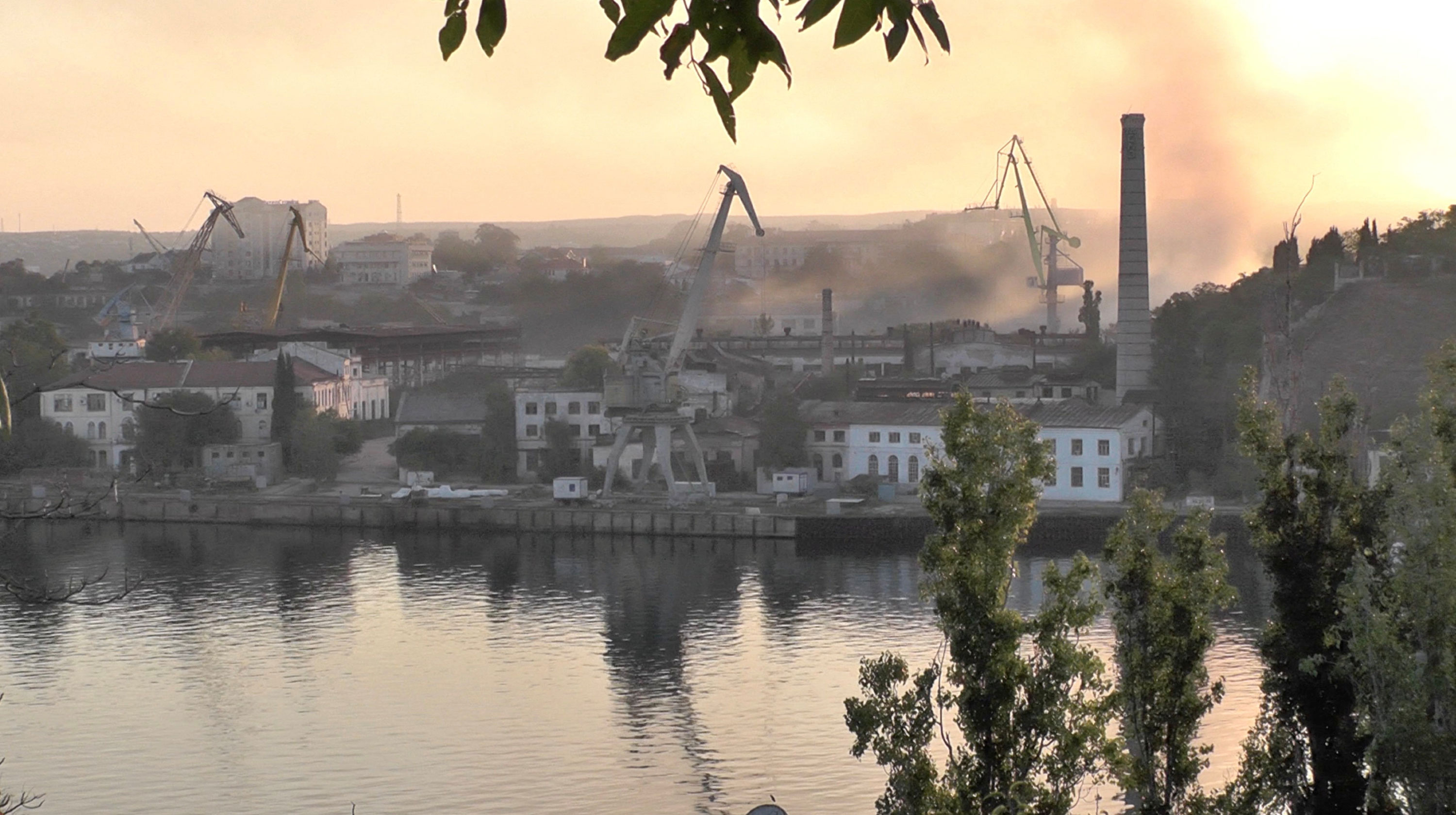 Smoke rises from the shipyard that was reportedly hit by Ukrainian missile attack in Sevastopol on September 13.