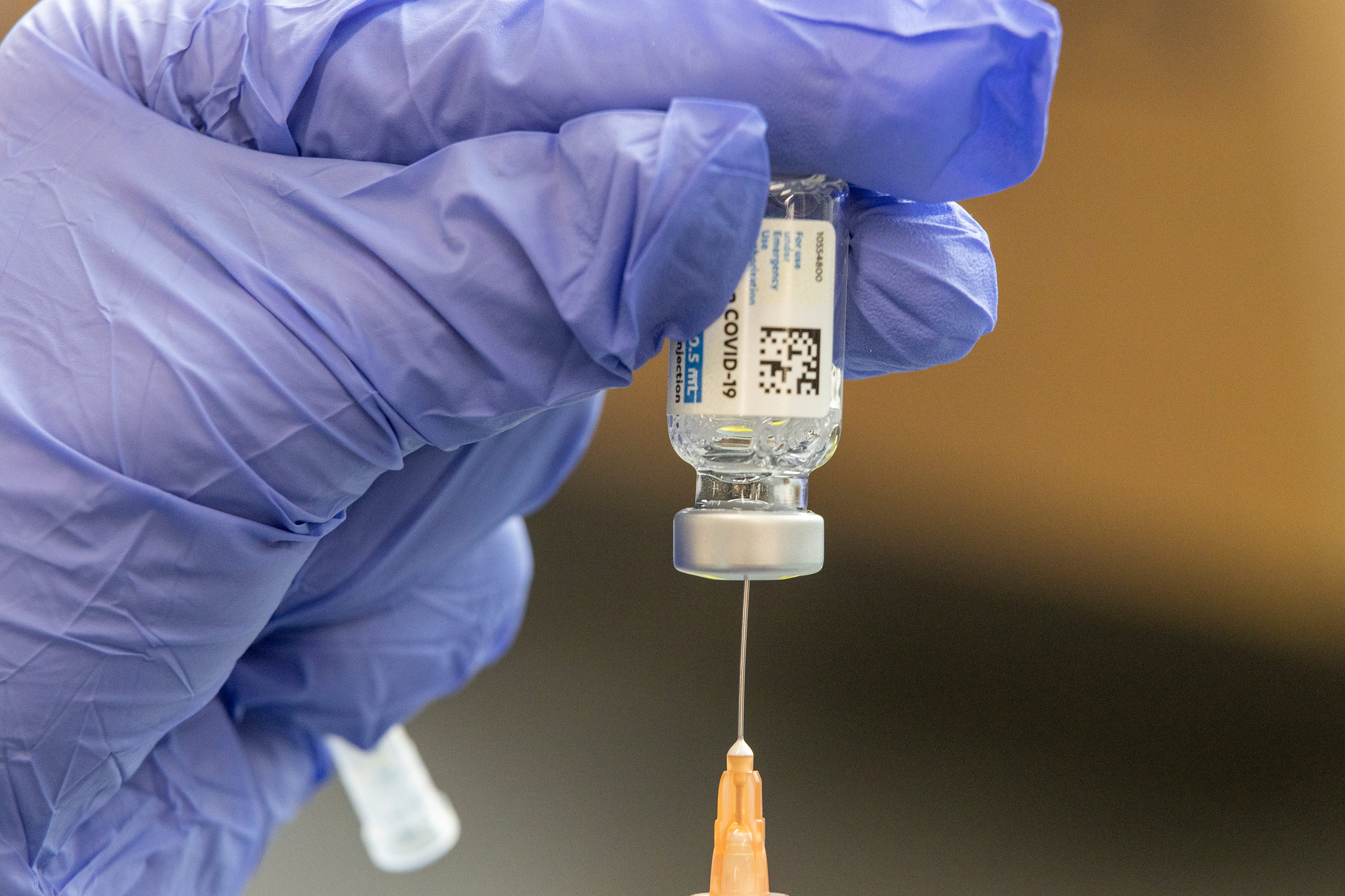 A healthcare worker loads a syringe with the Johnson & Johnson Covid-19 vaccine on March 26, in Buffalo, West Virginia. 