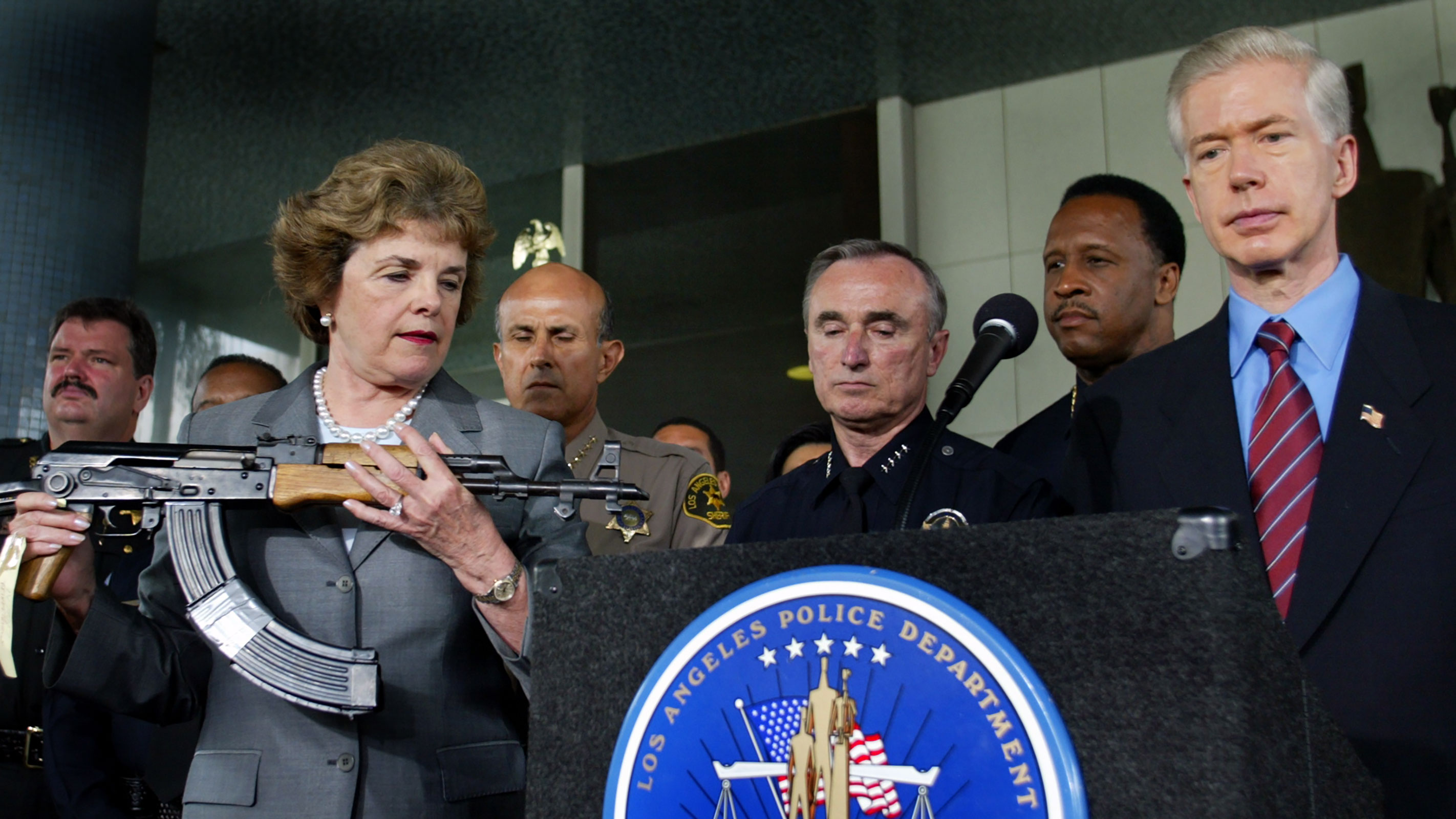 In this 2003 photo, Sen. Diane Feinstein holds AK-47 assault rifle during appearance with California Gov. Gray Davis and police chiefs from around the state to urge Congress to reauthorize the assault weapons ban signed into law in 1994.