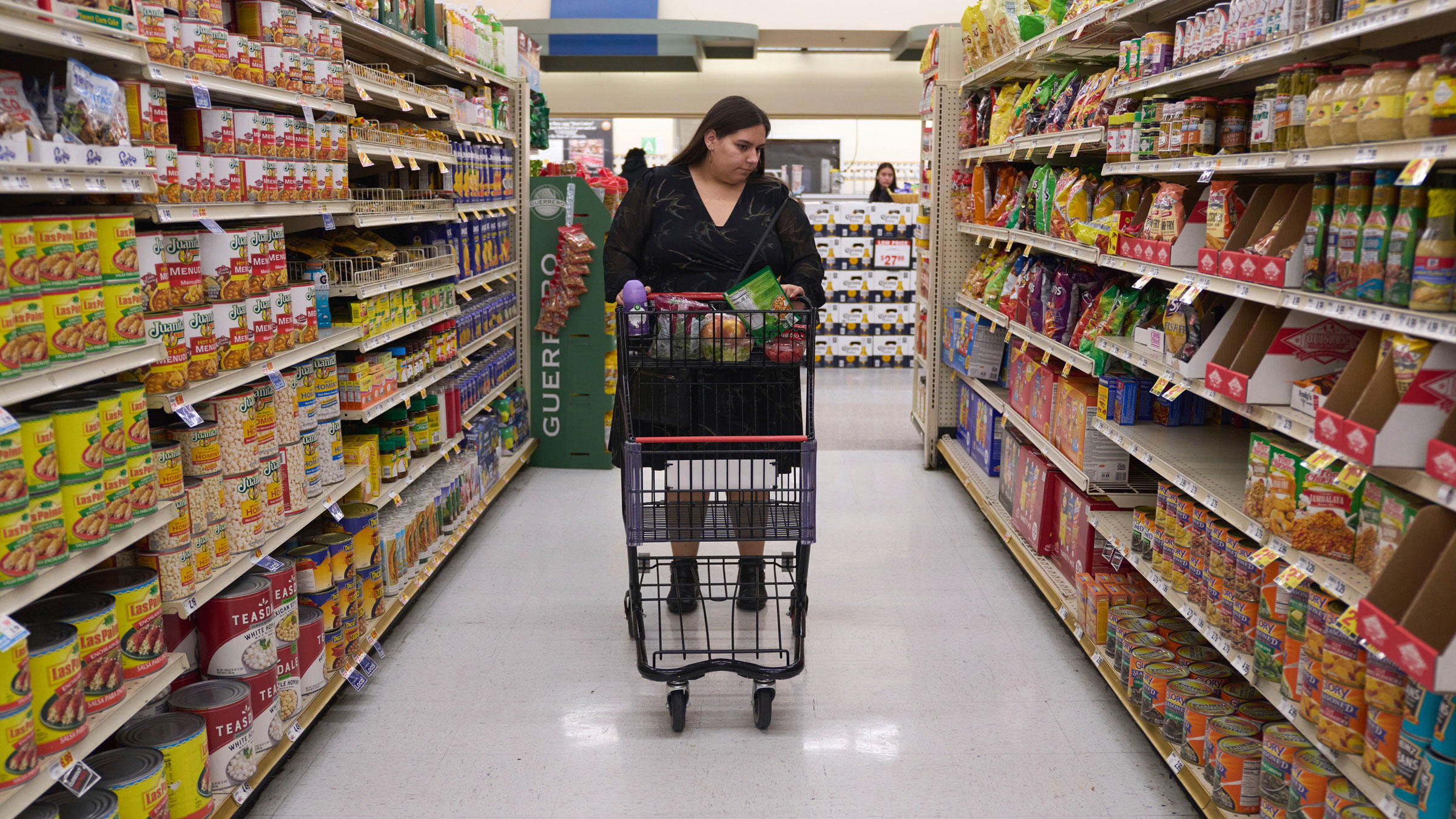 Jaqueline Benitez, who depends on California's SNAP benefits to help pay for food, shops for groceries at a supermarket in Bellflower, California, in February.