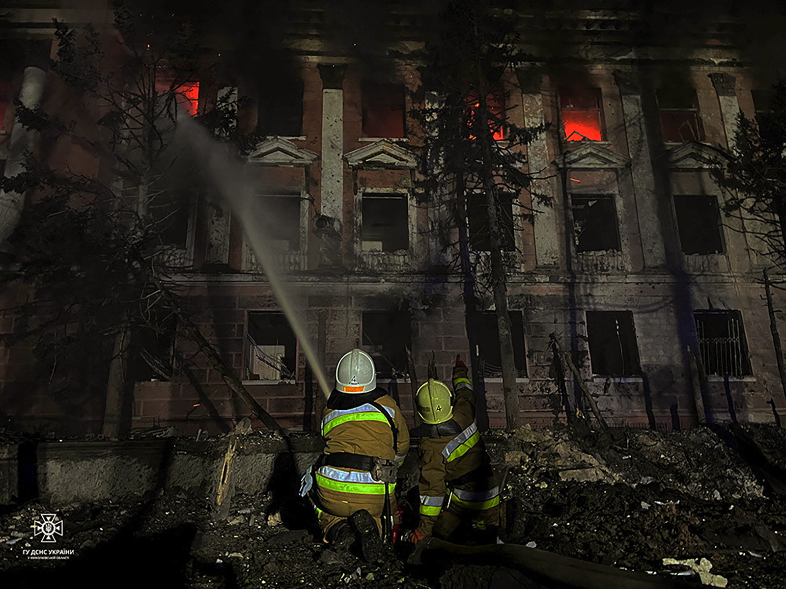 Firefighters work at a site of a building damaged by a Russian missile strike in Mykolaiv, Ukraine on April 27.