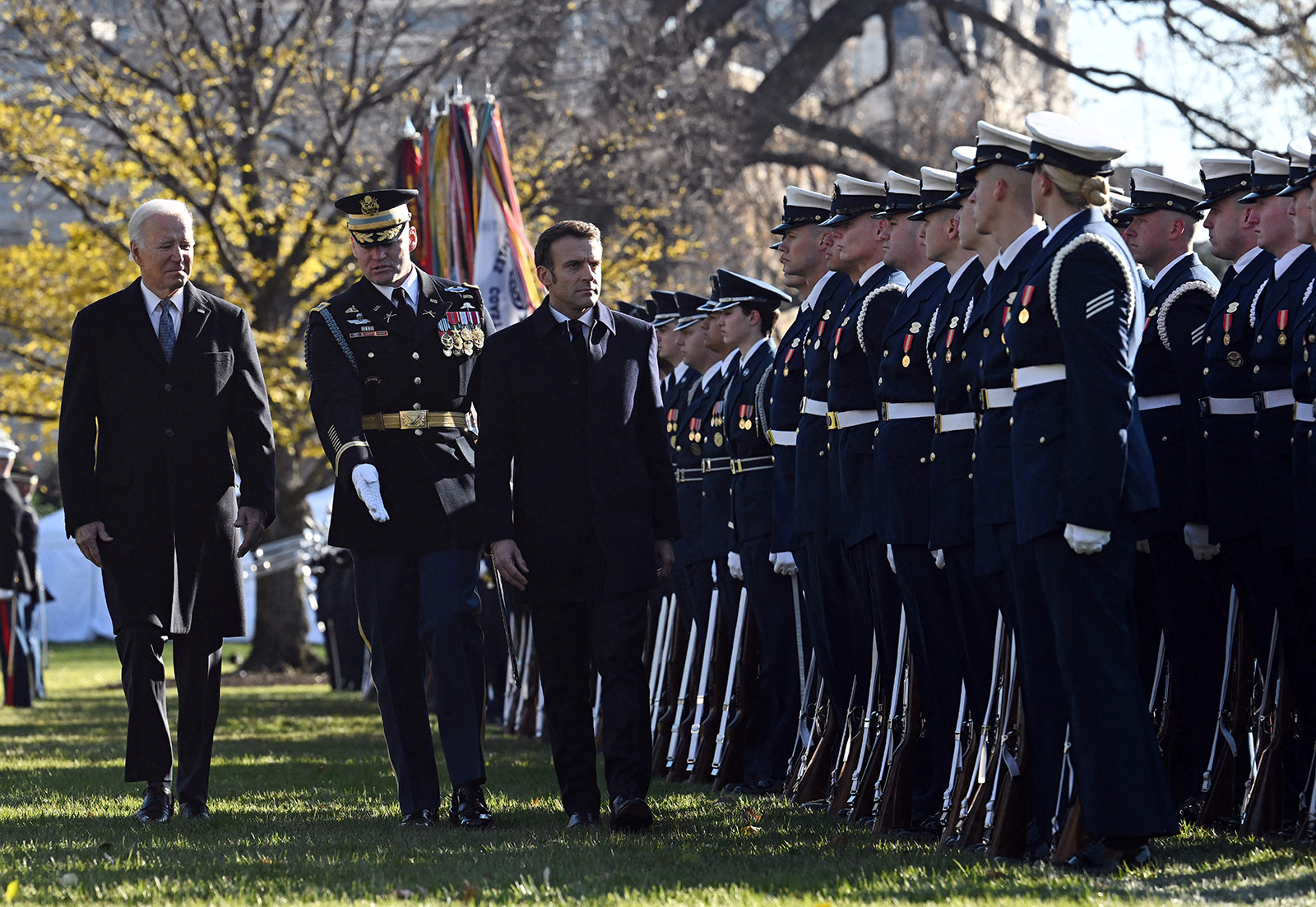 US President Joe Biden and French President Emmanuel Macron review troops during a welcoming ceremony for Macron at the White House on December 1. 
