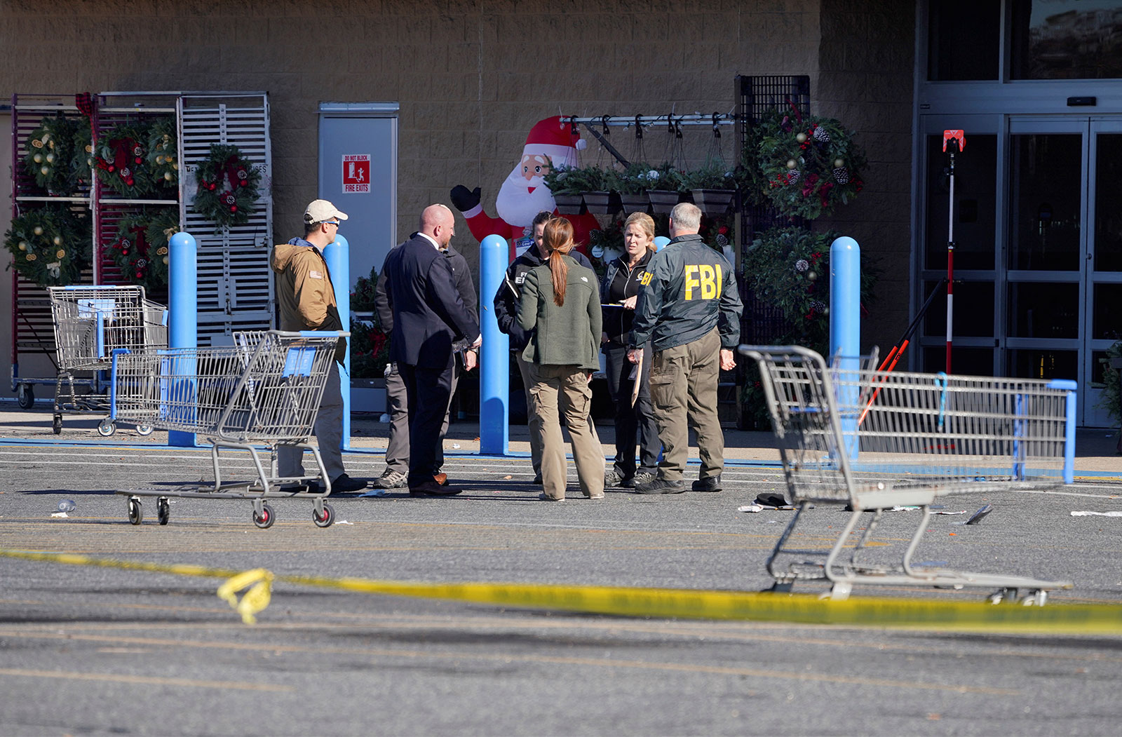 Members of law enforcement stand outside of a Walmart in Chesapeake, Virginia, on November 23. 