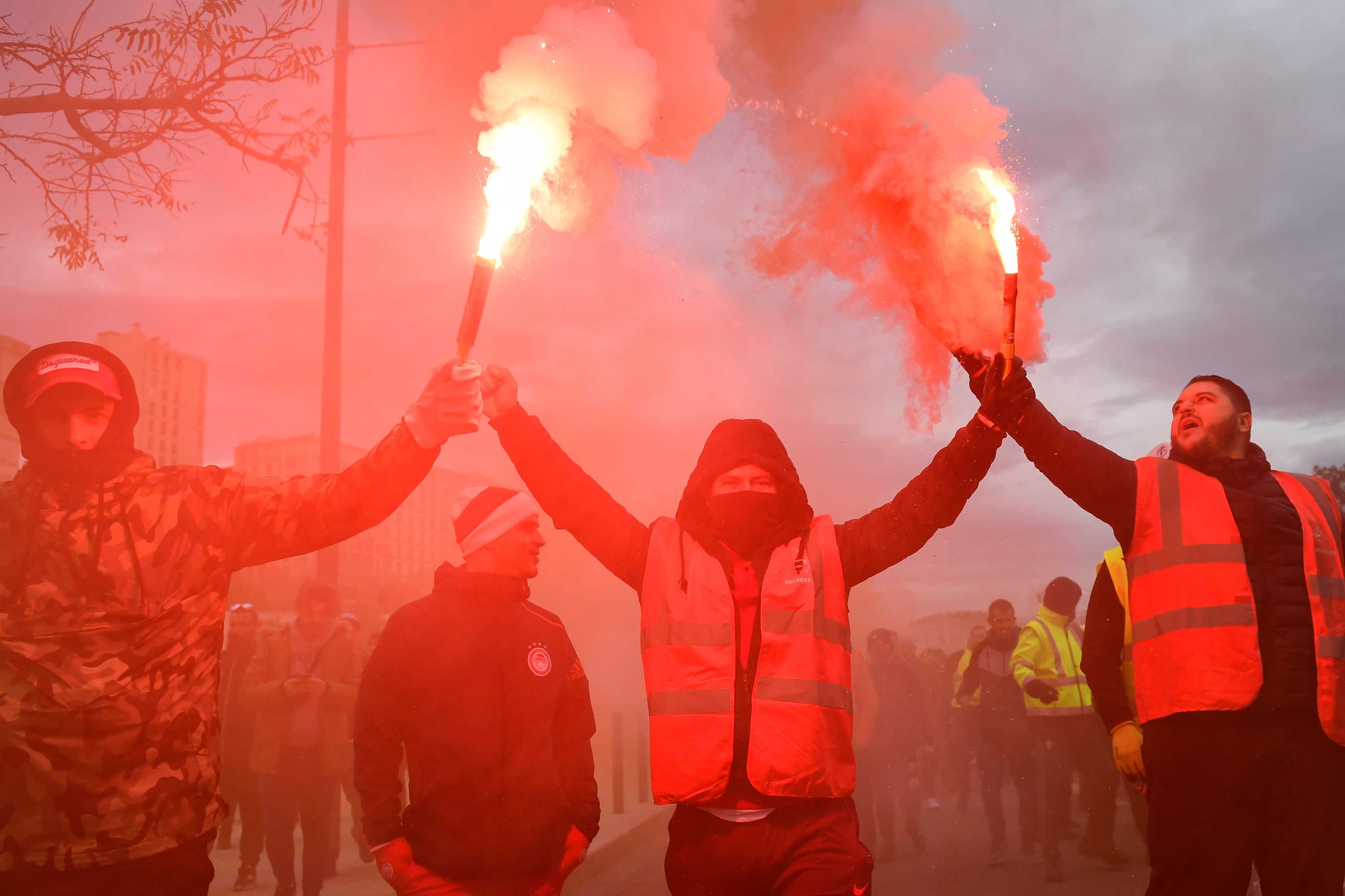 Also in Marseille, dockers march with smoke bombs in hand. Photo: Clement Mahoudeau/AFP via Getty Images