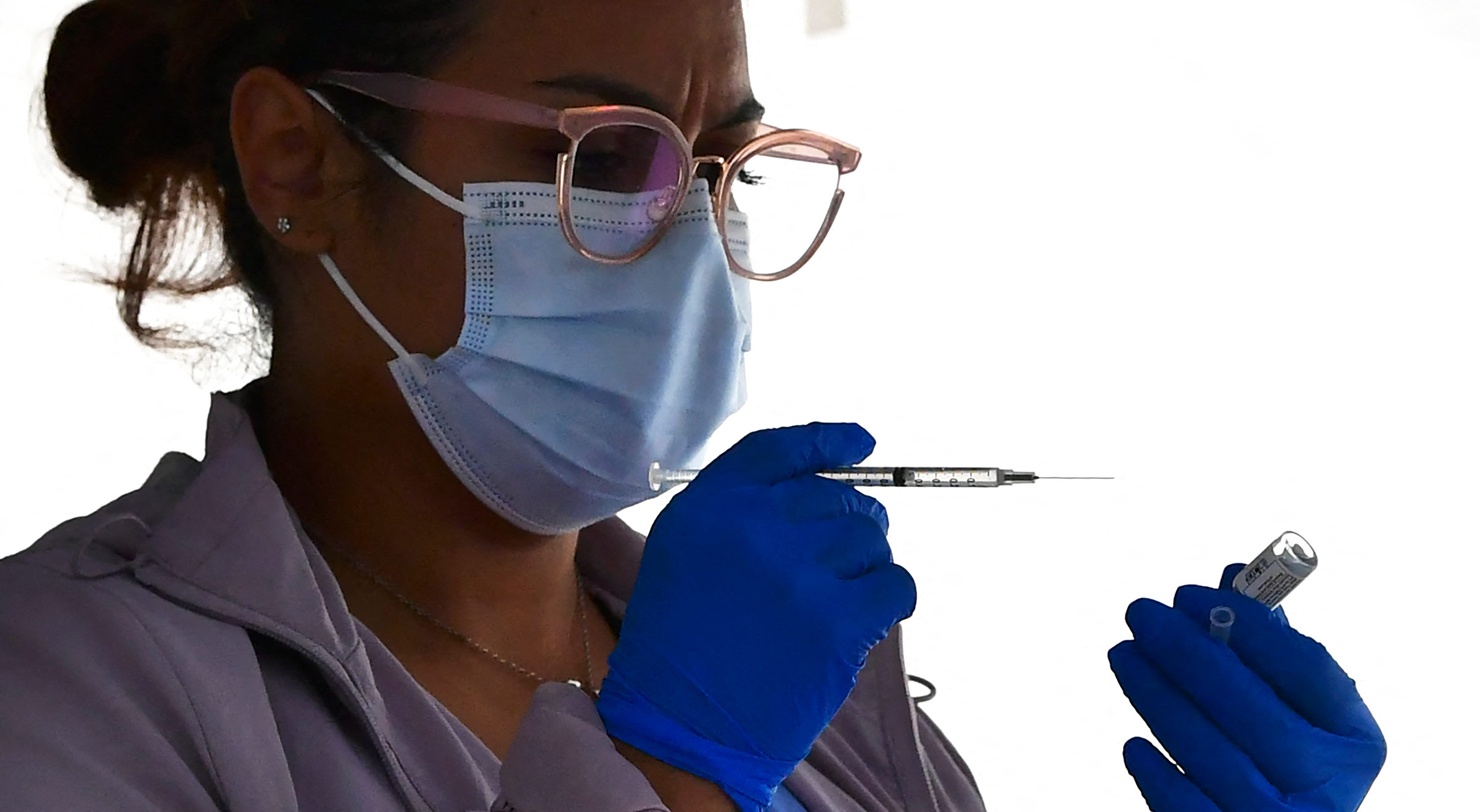 A nurse prepares a Johnson & Johnson Covid-19 vaccine dose on March 25, in Los Angeles, California. 