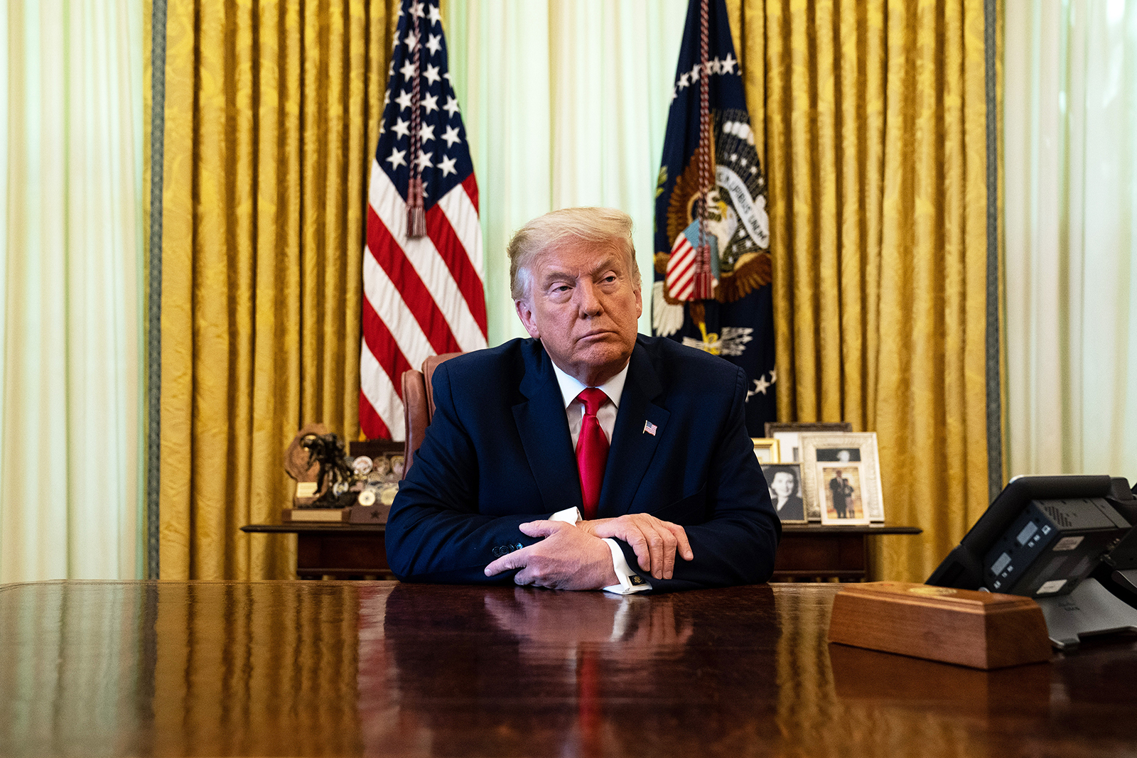 US President Donald Trump listens during an event in the Oval Office of the White House August 28, 2020 in Washington, DC.