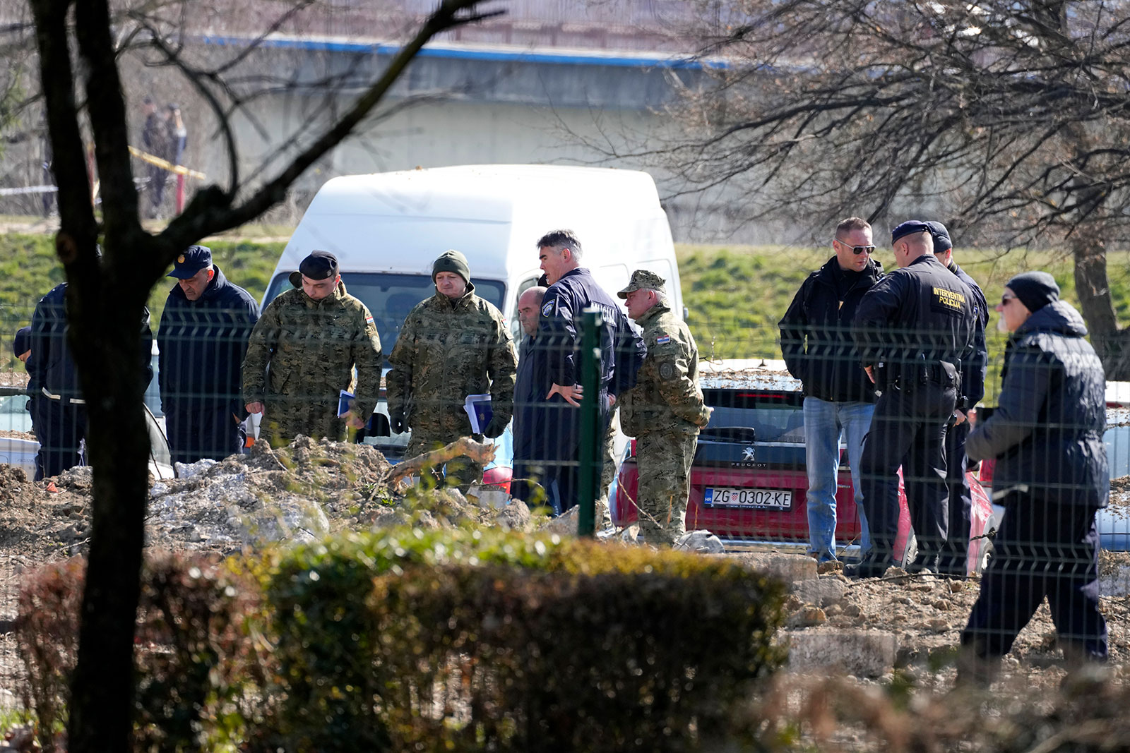 Police inspect the site of a drone crash in Zagreb, Croatia on March 11. 
