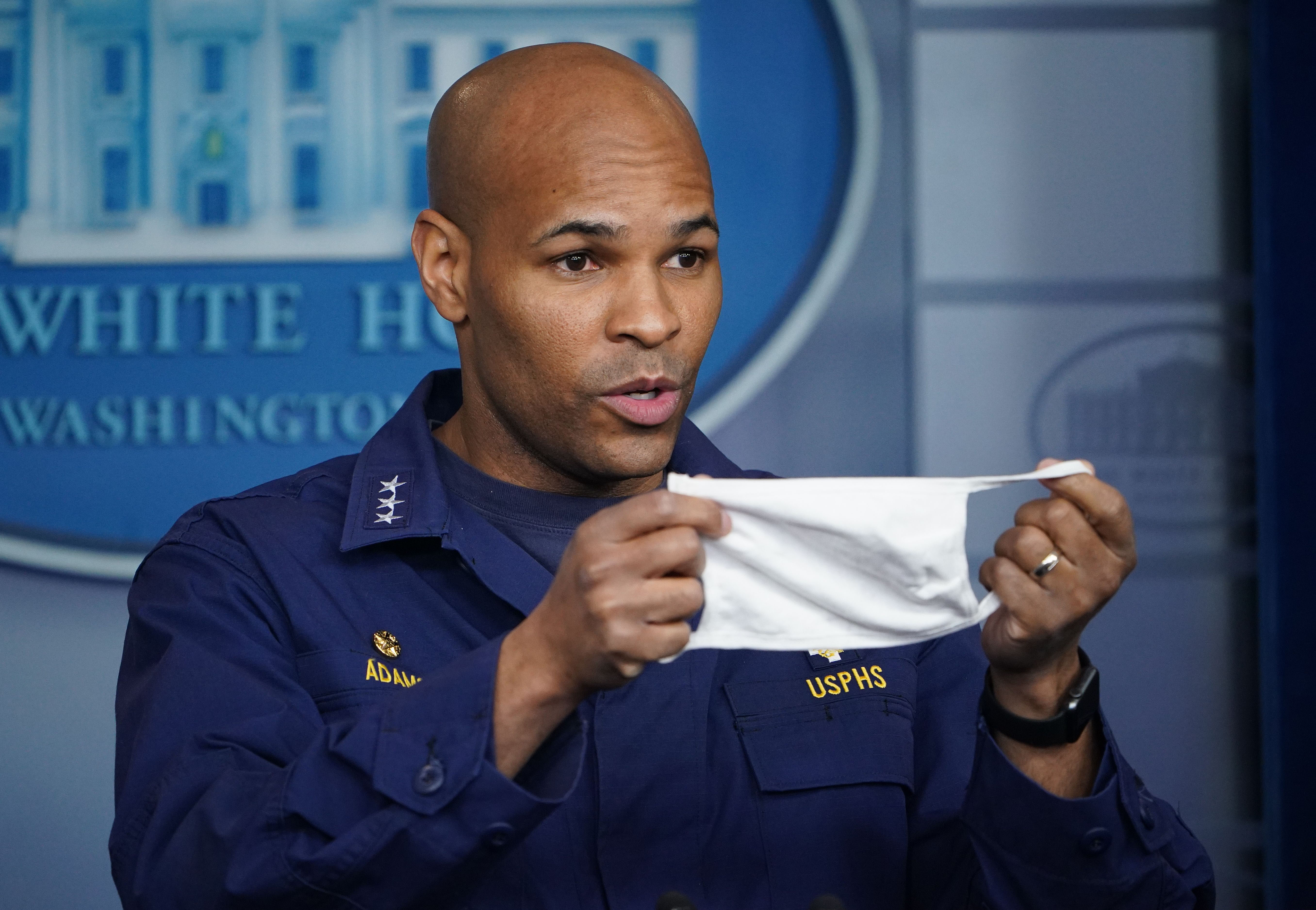 US Surgeon General Jerome Adams holds a face mask during a coronavirus briefing at the White House on April 22.