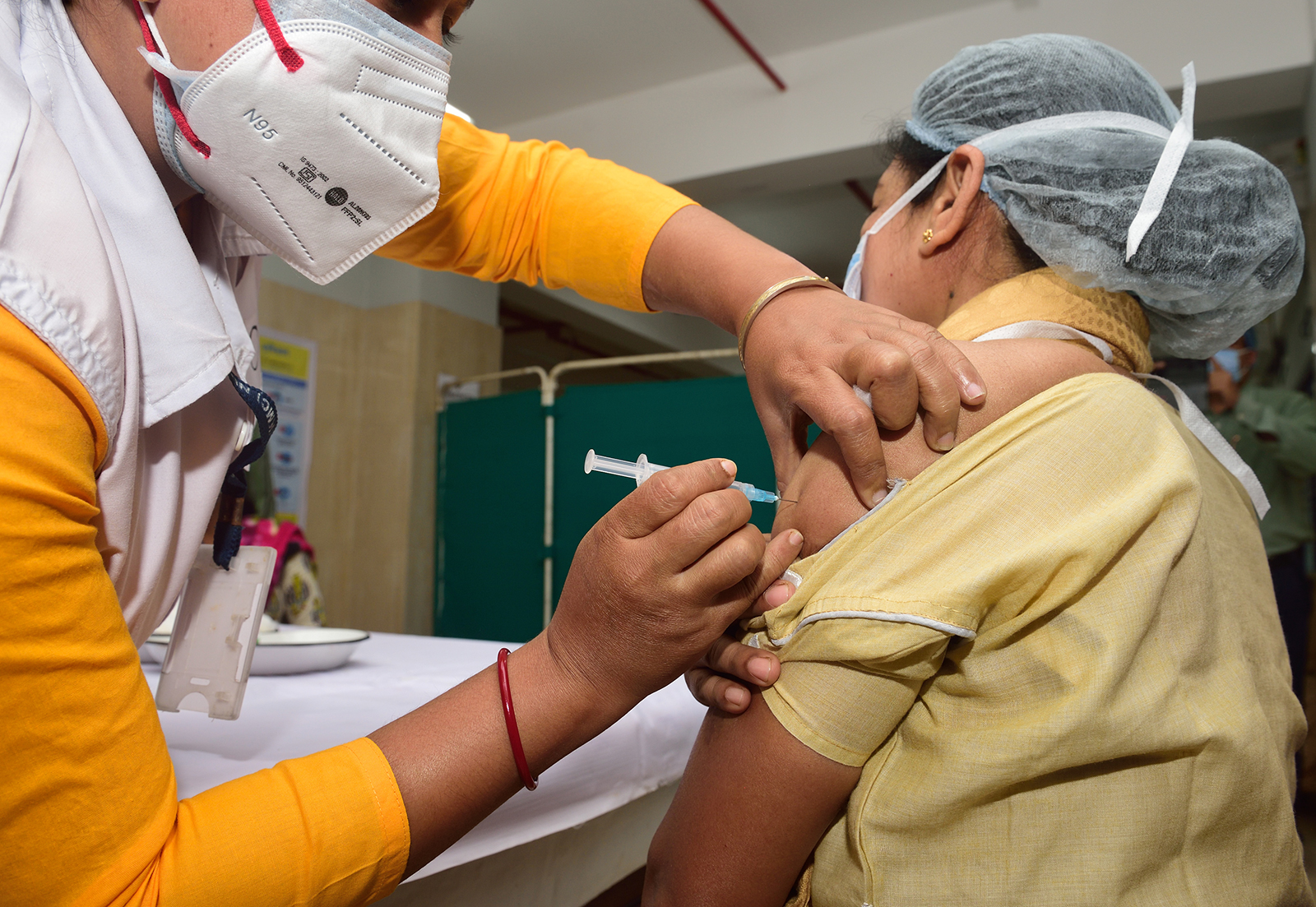 A healthcare worker vaccinates a frontline health worker with the Covishield Covid-19 vaccine in Kolkata, on January 19.