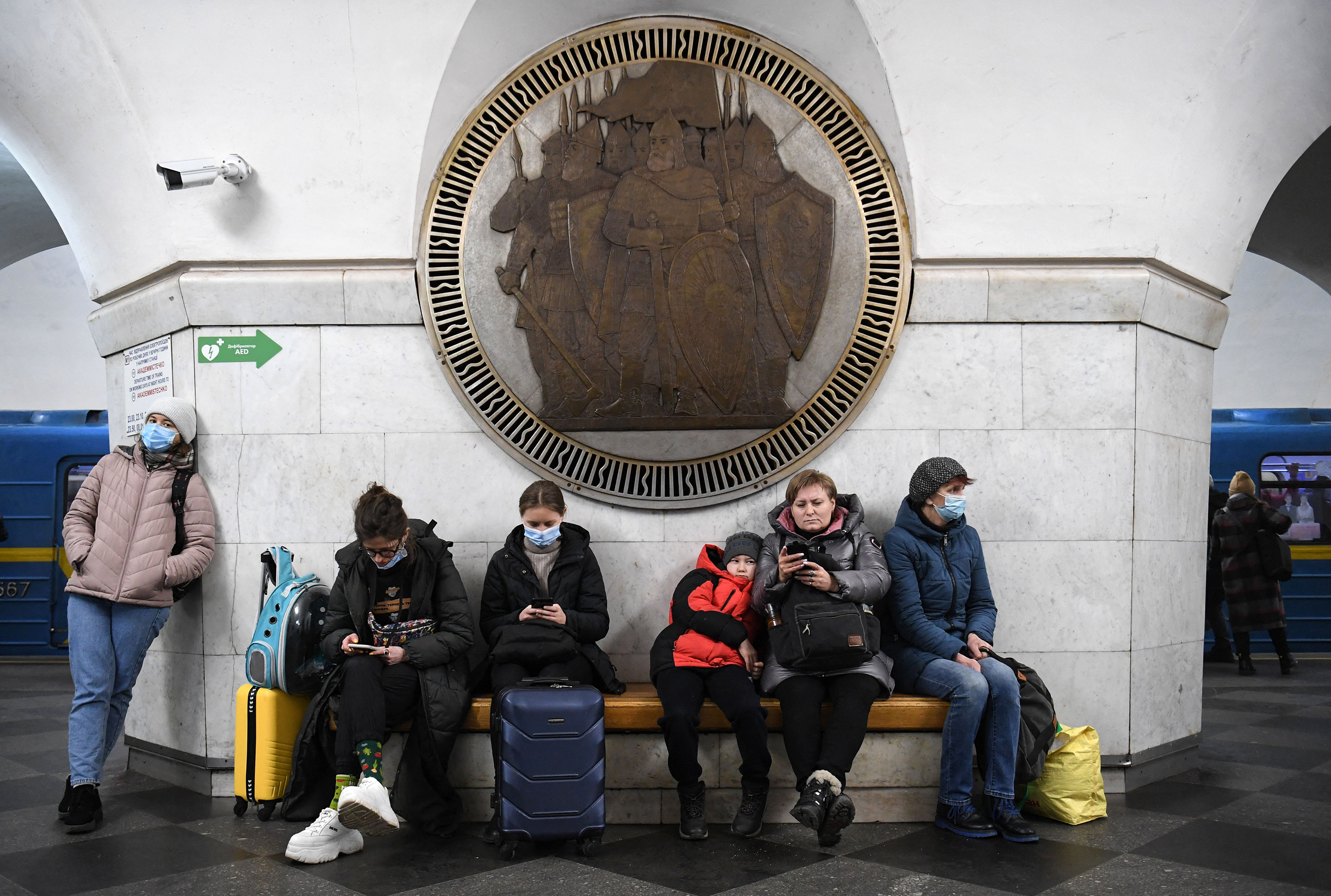 People take shelter in the Vokzalna metro station of Kyiv, Ukraine, on February 24. (Daniel Leal/AFP/Getty Images)