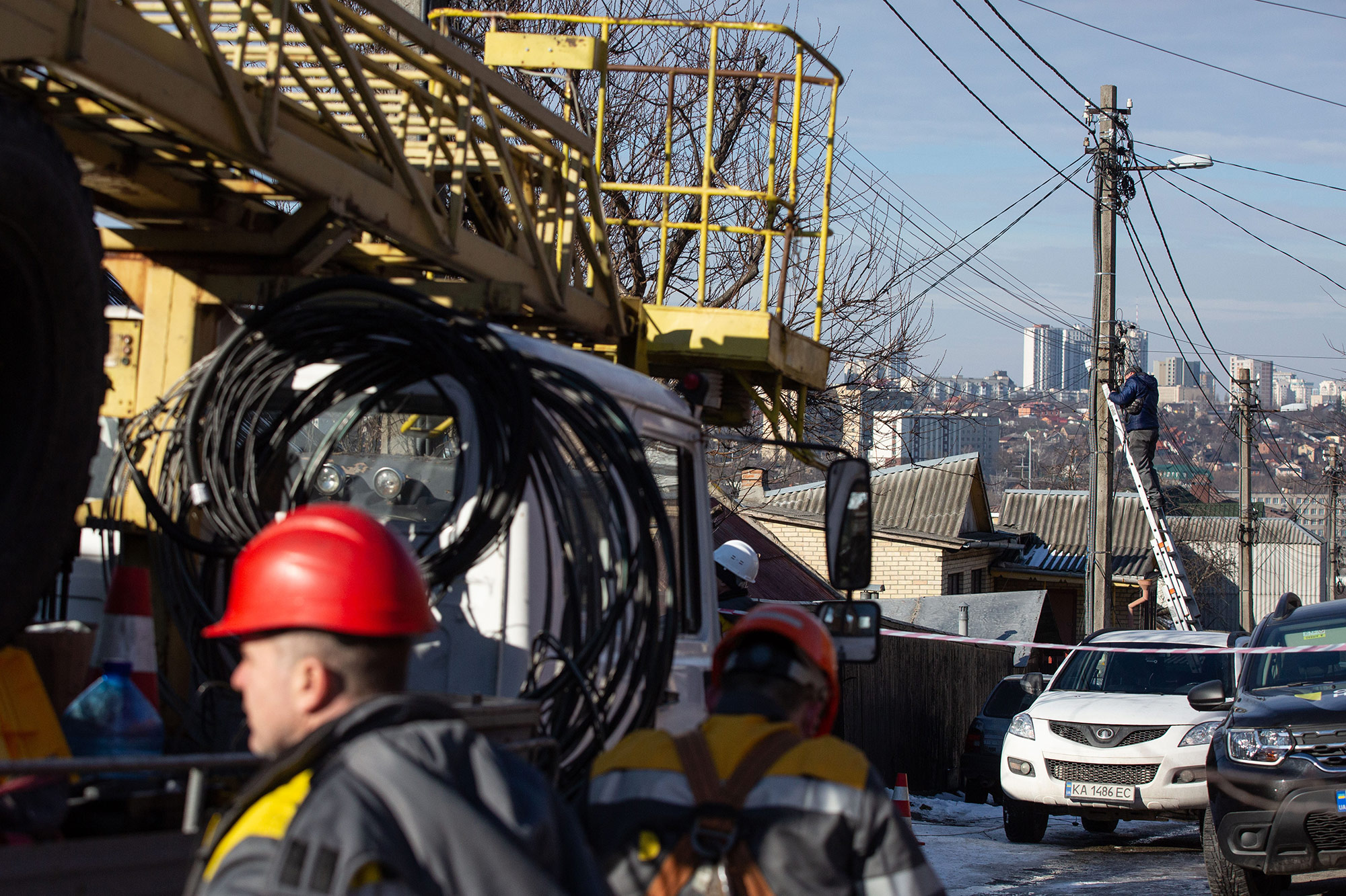Electricians repair power lines in Kyiv, Ukraine, on February 10. 