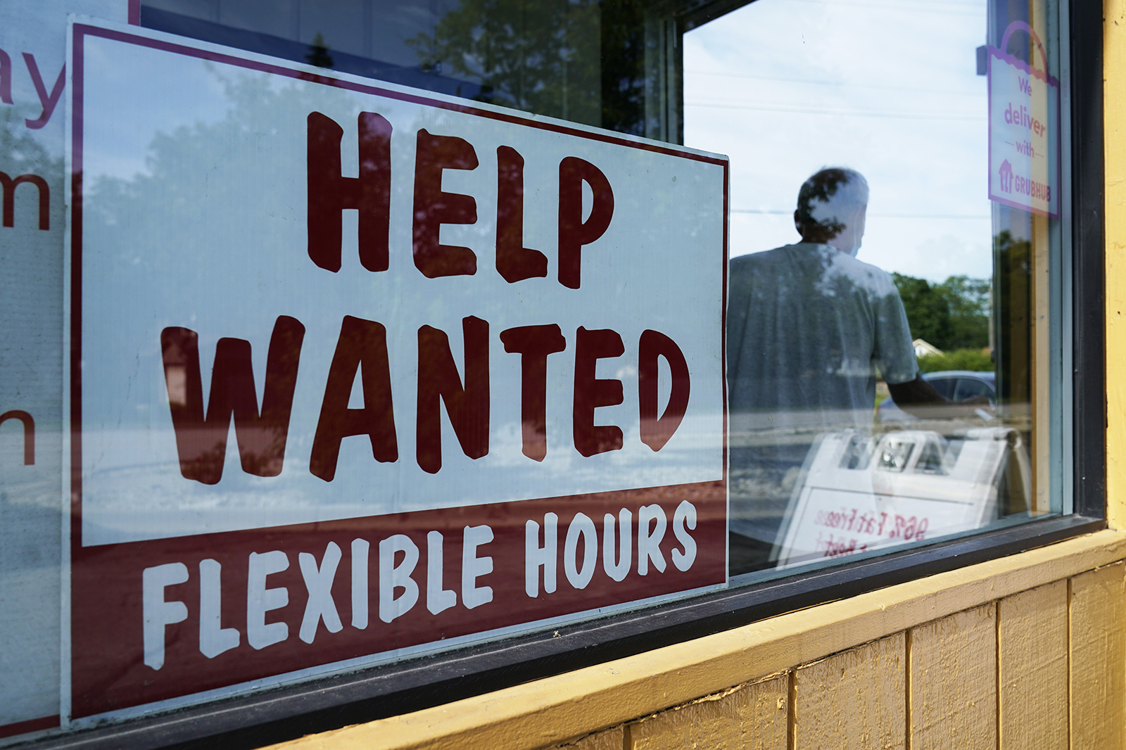 Help wanted sign is displayed in Deerfield, Ill., on Wednesday, Sept. 21.