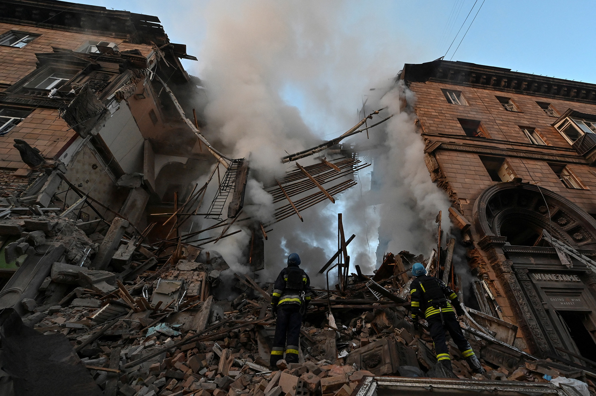 Rescuers work on a residential building which was heavily damaged by a Russian missile strike in Zaporizhzhia, Ukraine on October 6.