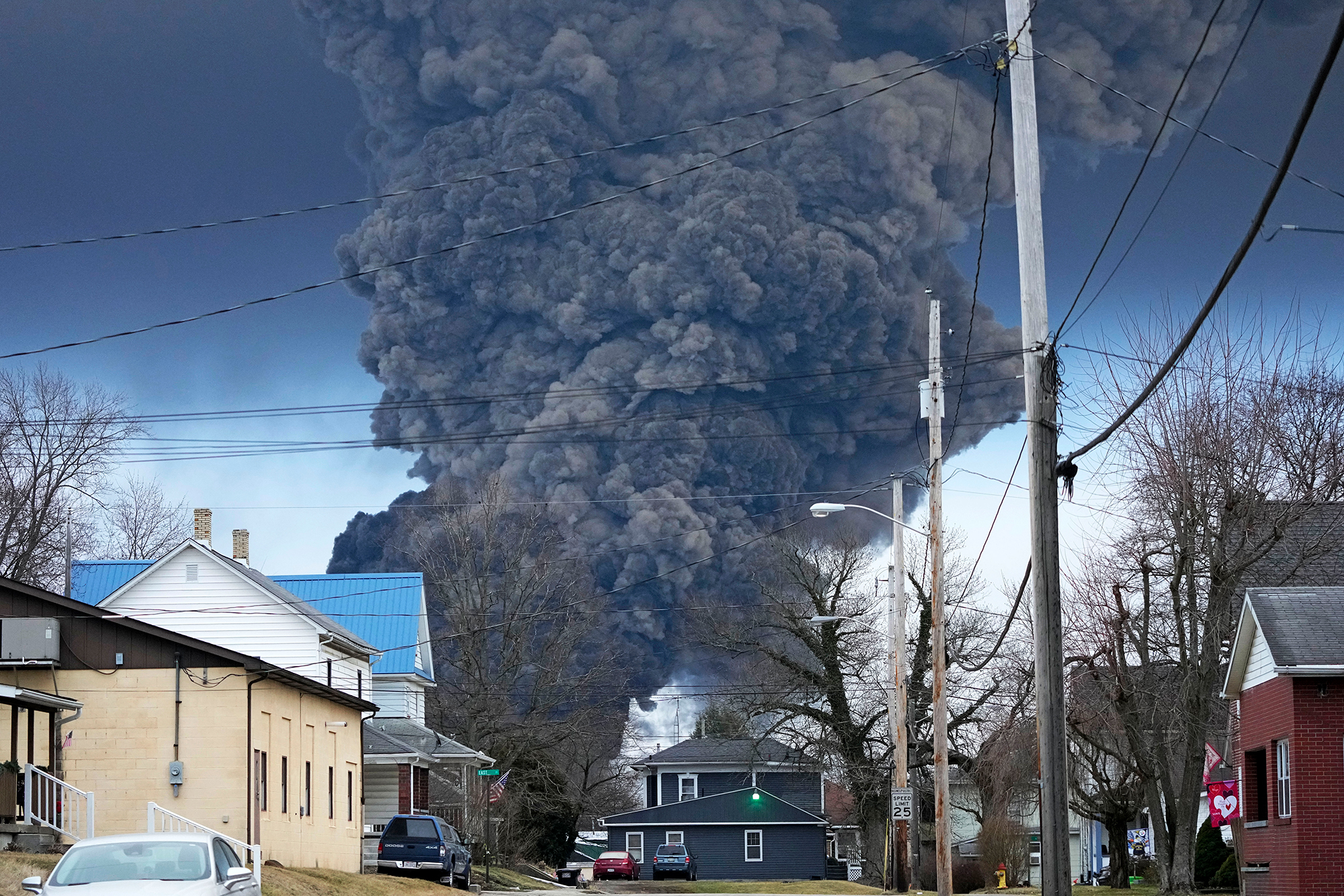 A black plume rises over East Palestine, Ohio, as a result of a controlled detonation of a portion of the derailed Norfolk Southern trains on Monday, February 6. 