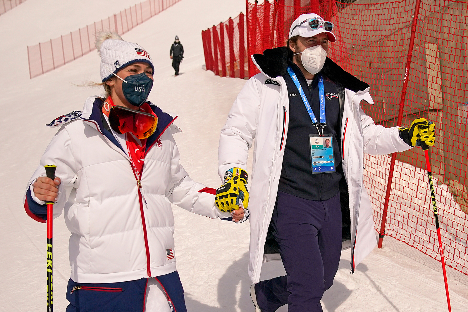 Norway's Aleksander Aamodt Kilde, right, and his girlfriend, Team USA's Mikaela Shiffrin, leave the finish area for the women's super-G on Feb. 11.