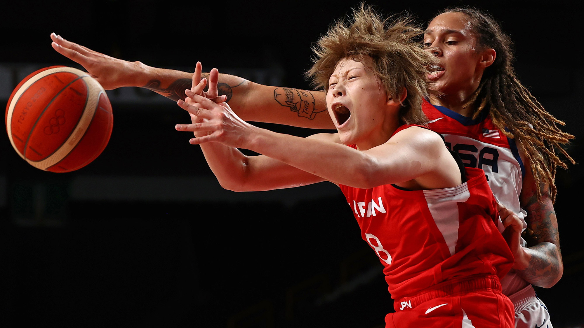 The United States' Brittney Griner, right, defends Japan's Maki Takada during the gold-medal basketball game on Sunday, August 8.