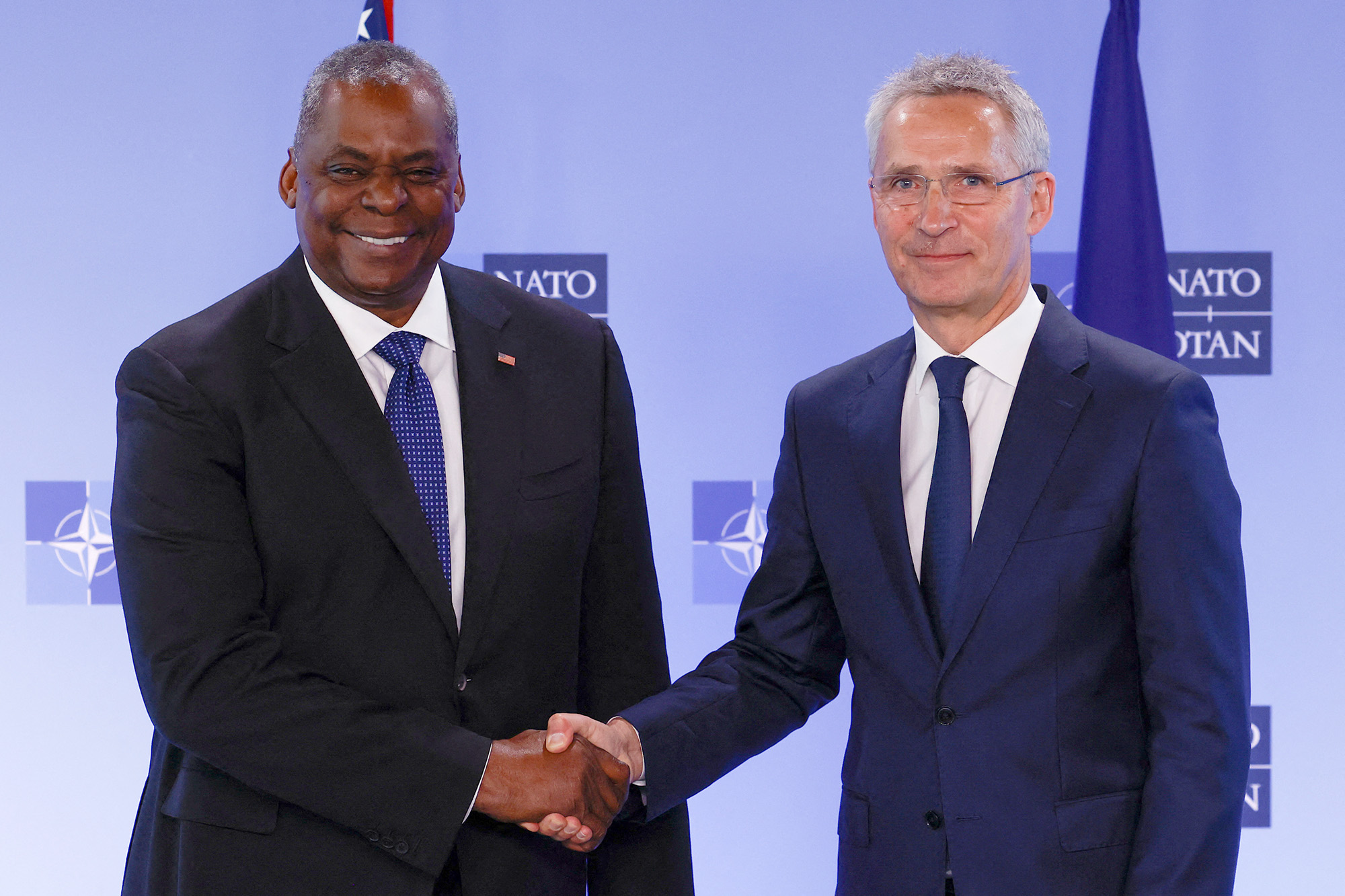 NATO Secretary General Jens Stoltenberg and U.S. Defense Secretary Lloyd Austin shake hands as they take part in a NATO defence ministers meeting at the Alliance's headquarters in Brussels, Belgium, on June 16.