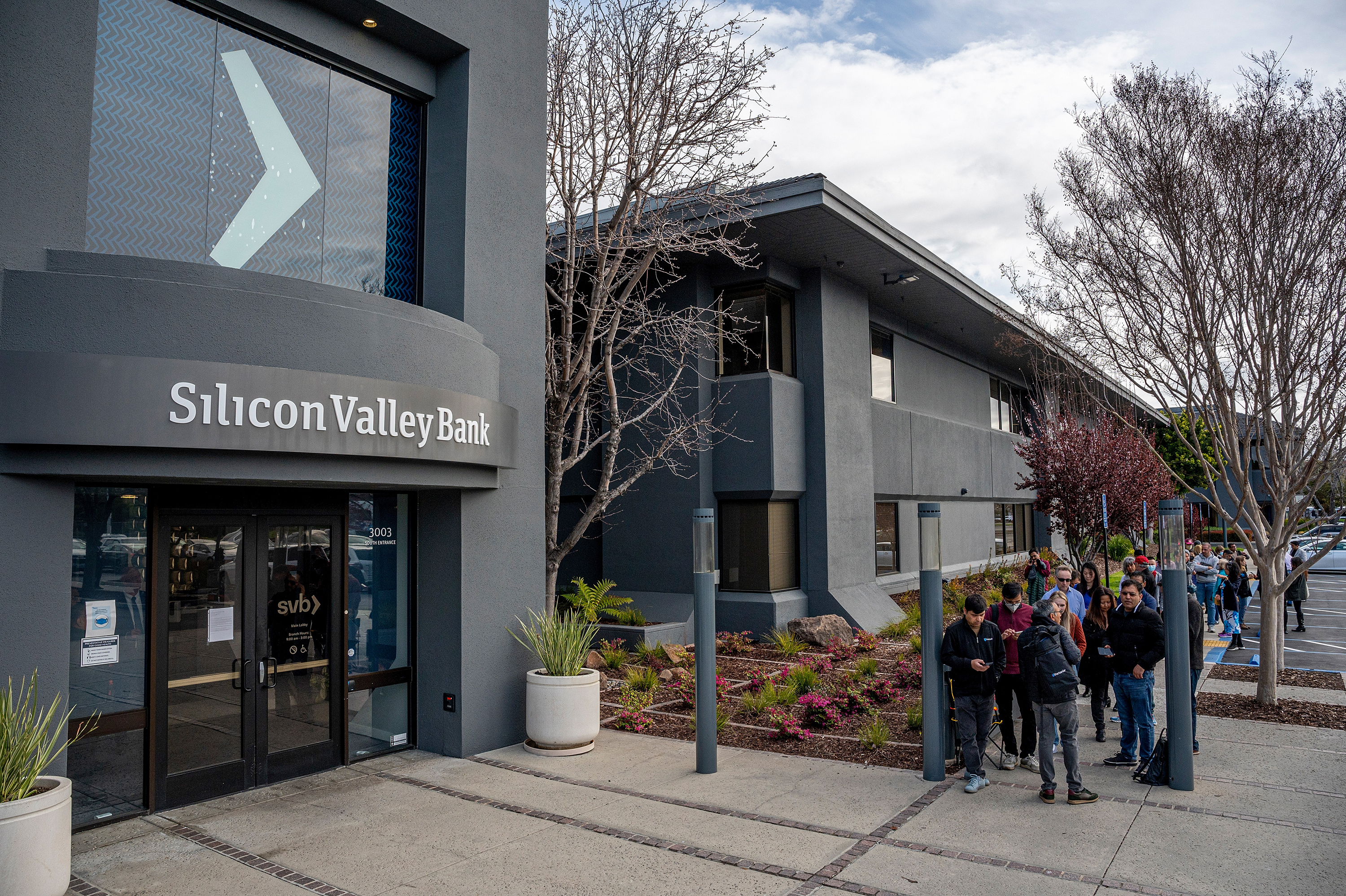 Customers in line outside Silicon Valley Bank headquarters in Santa Clara, California, on March 13. 