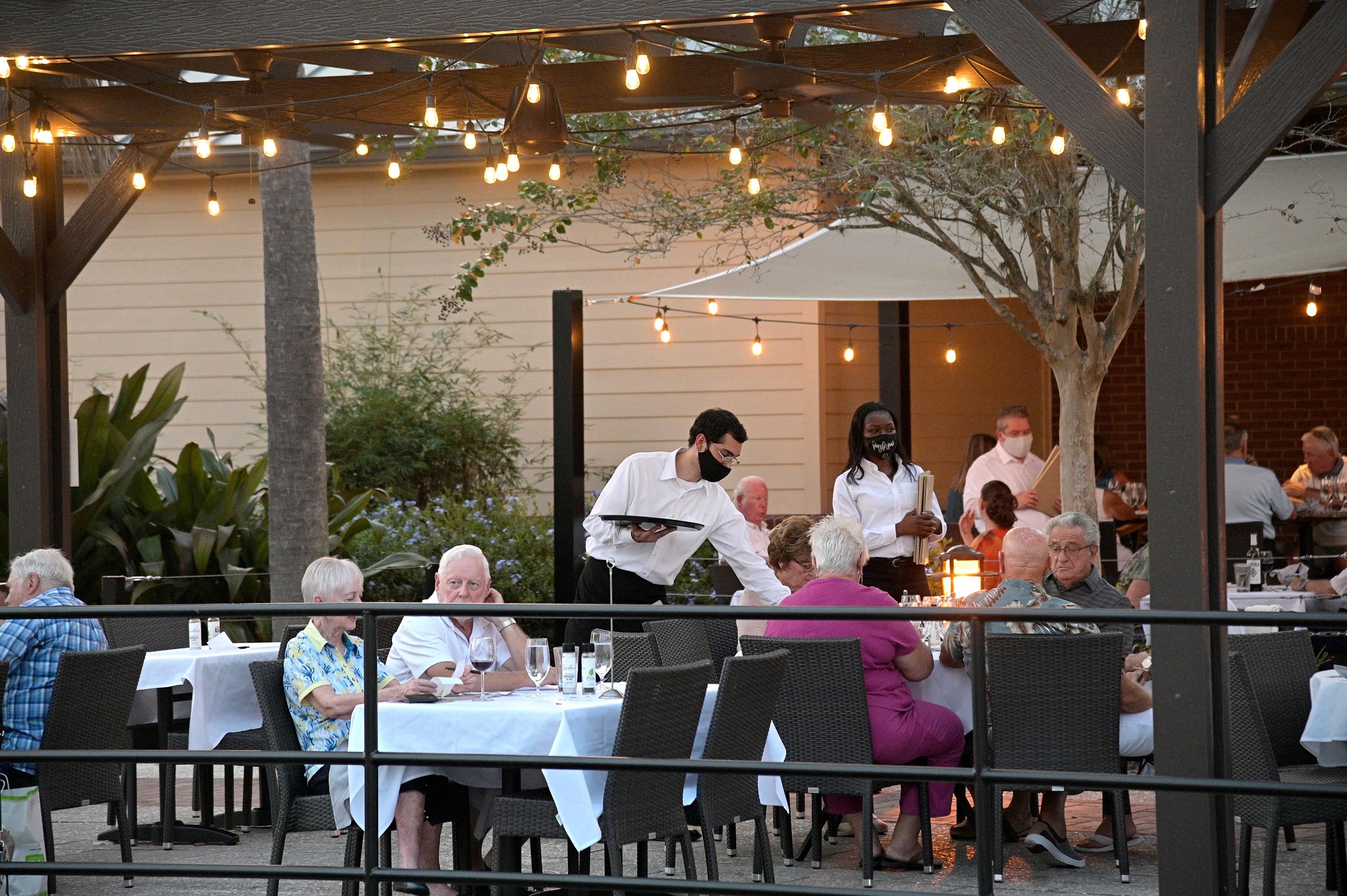 People dine at a restaurant in The Villages, Florida, in October 2020.