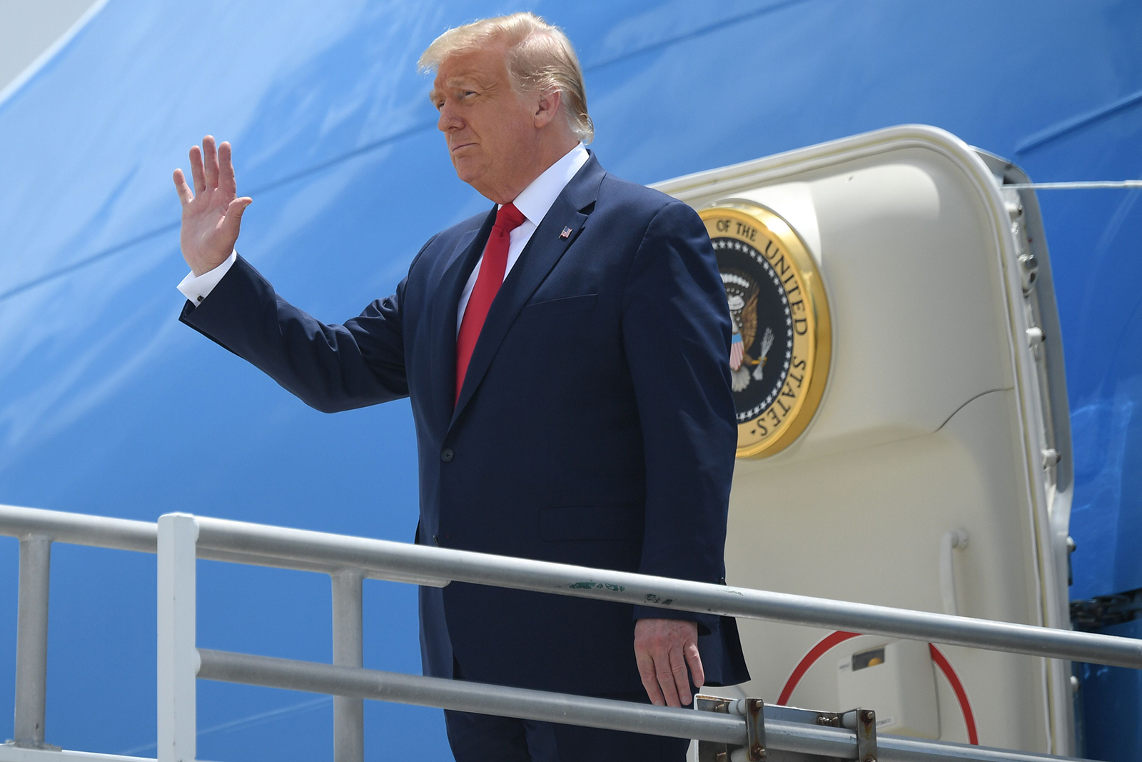 President Donald Trump disembarks from Air Force One upon arrival at Miami International Airport in Miami on July 10.