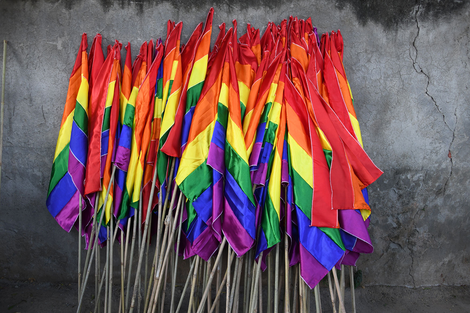 Rainbow flags are placed against a wall before a pride parade of Indian members and supporters of the lesbian, gay, bisexual, and transgender (LGBT) community in New Delhi on November 25, 2018.