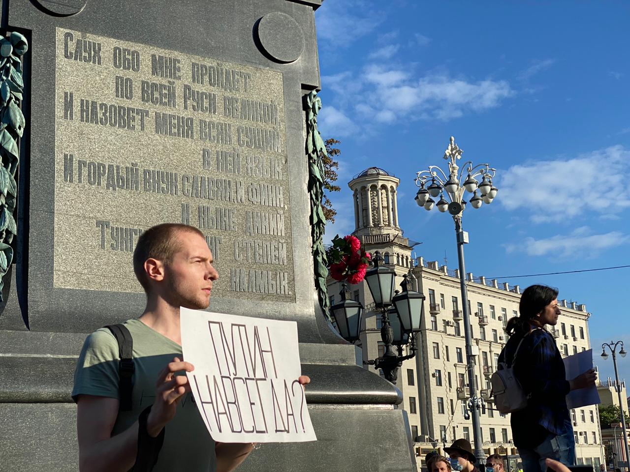 A man in Pushkin Square holding a poster that reads: “Putin forever?” Mary Ilyushina/CNN