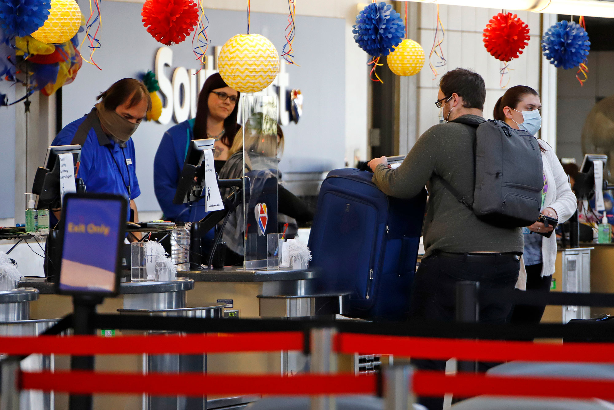 Travelers check in at the Southwest Airline ticket counter at Greater Pittsburgh International Airport on May 7.