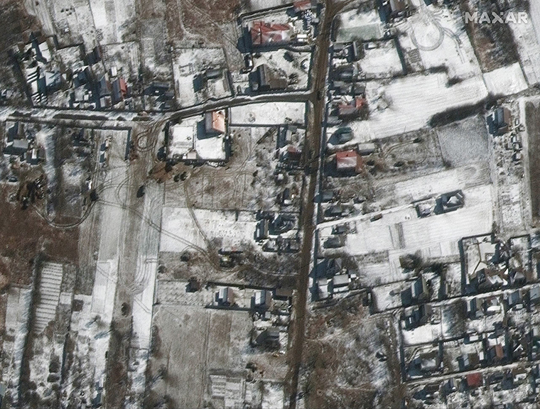 Russian military vehicles are seen sitting on roadways in residential areas in the town of Ozera, Ukraine -- 17 miles northwest of Kyiv. 