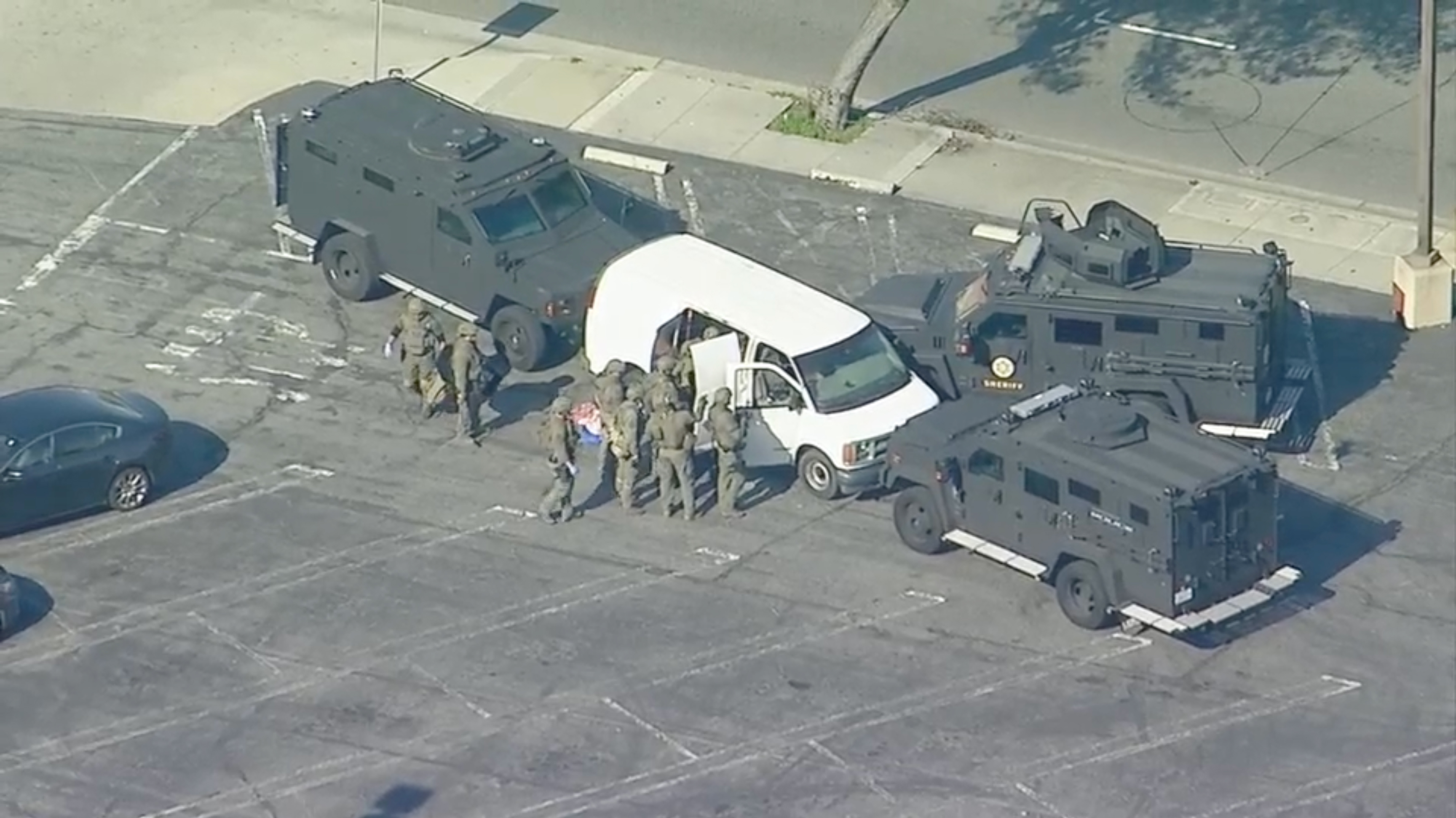 A tactical team is searching the van from the Torrance standoff