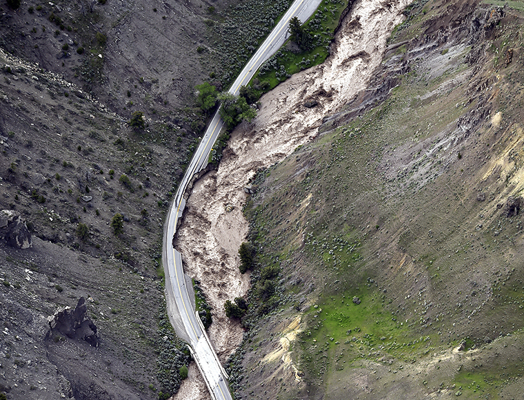 The highway between Gardiner and Mammoth is shown in Gardiner, Montana, as historic flooding damages roads, bridges and homes on Monday, June 13.