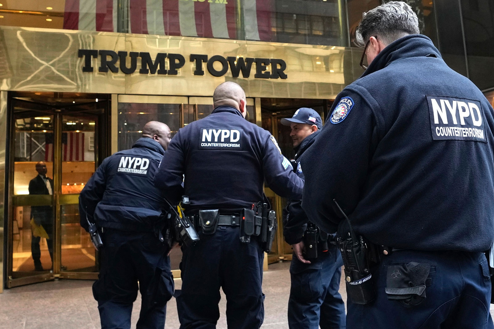 Several members of the NYPD enter Trump Tower on Friday, March 31, in New York.