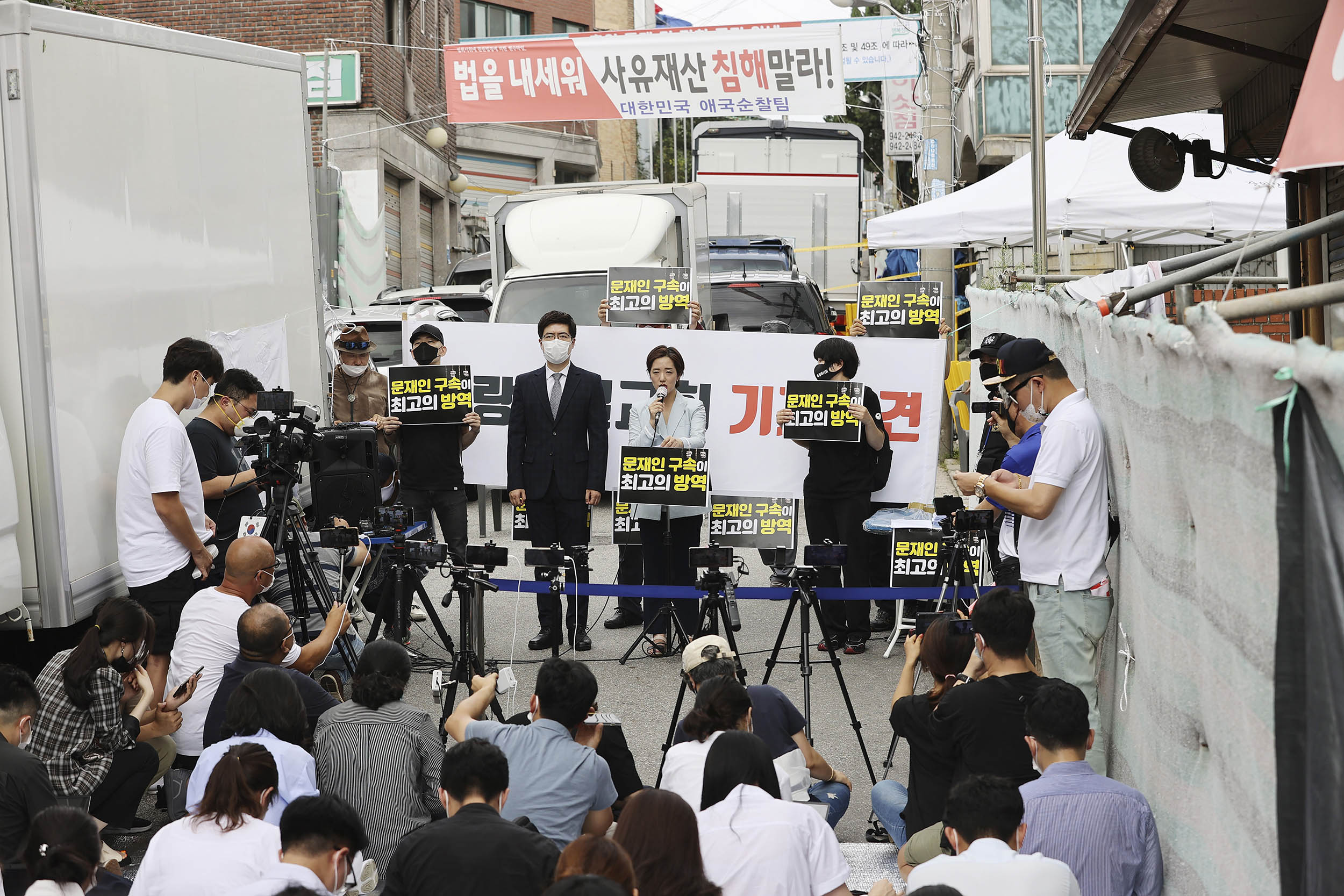 Sarang-jeil Church pastor Jun Kwang-hun's lawyer, Kang Yeon-jae, top center, speaks during a news conference near the church in Seoul, South Korea, on Monday, August 17.