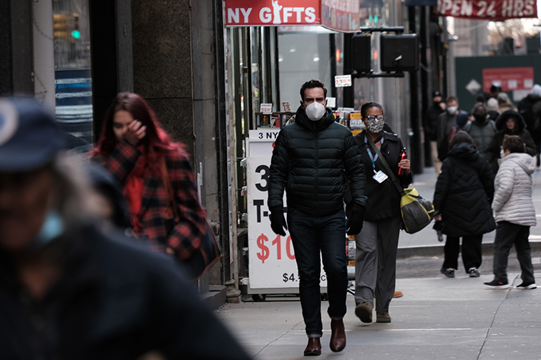 People wear face masks in Manhattan on November 29, 2021 in New York City. 