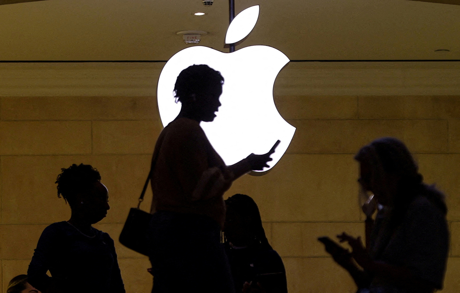 A woman uses an iPhone mobile device at the Apple store at Grand Central Terminal in New York City, on April 14.