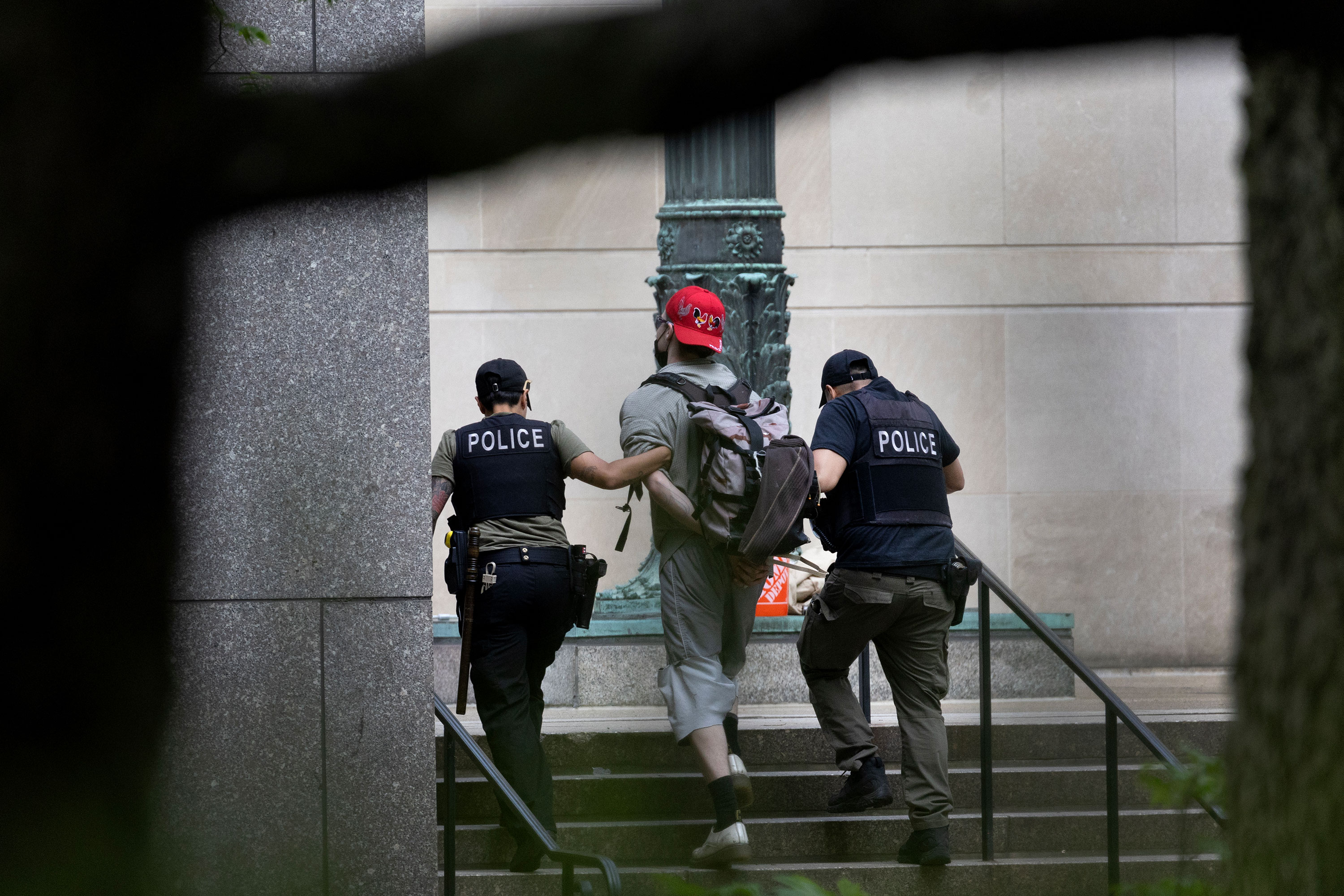 Police detain a demonstrator on the campus of the Art Institute of Chicago on May 4. 