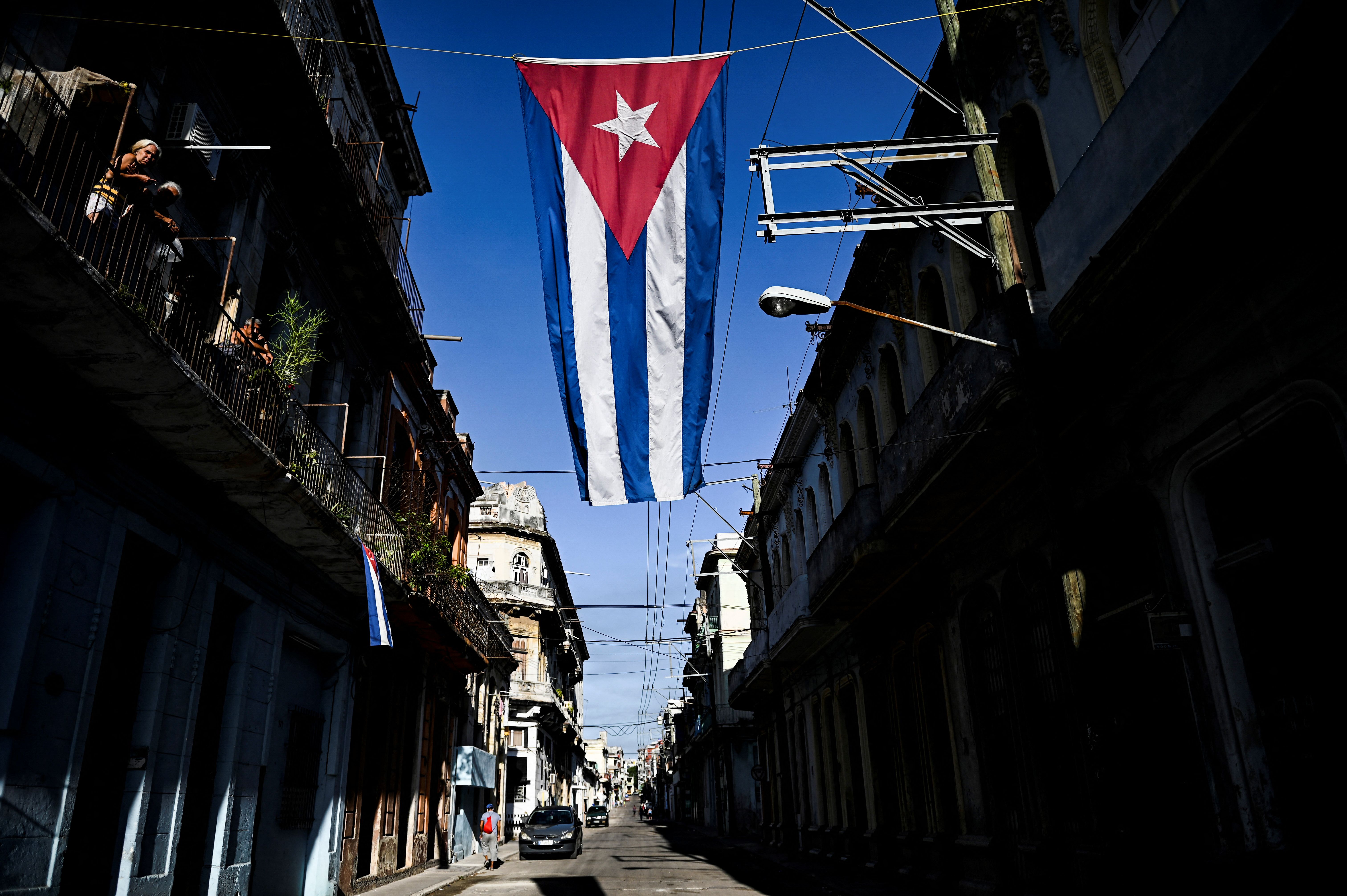 A cuban flag hangs above a street in Havana, Cuba, on August 19, 2021.