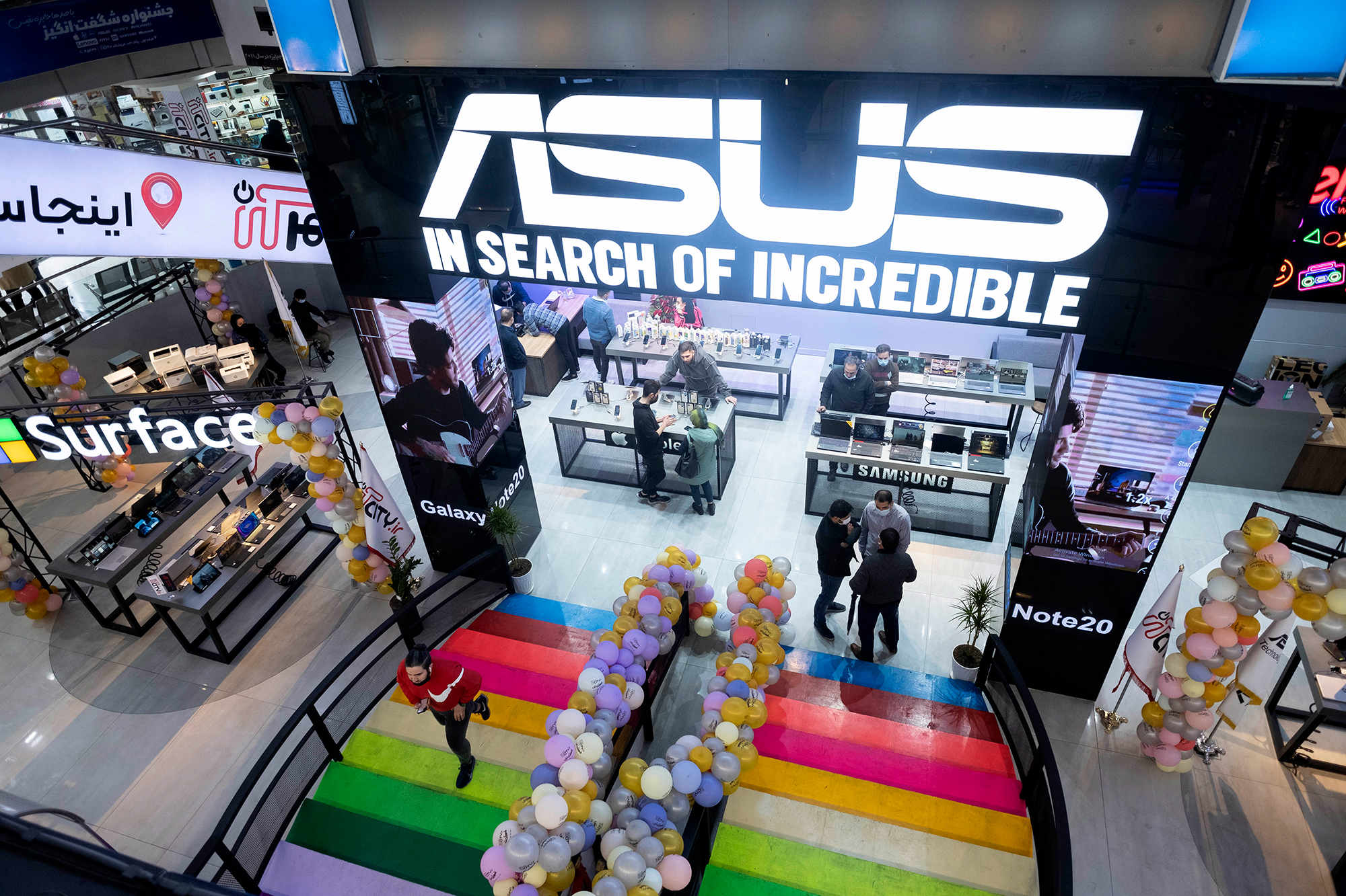 An ASUS sign is seen inside a shop in Tehran, Iran in 2021. 