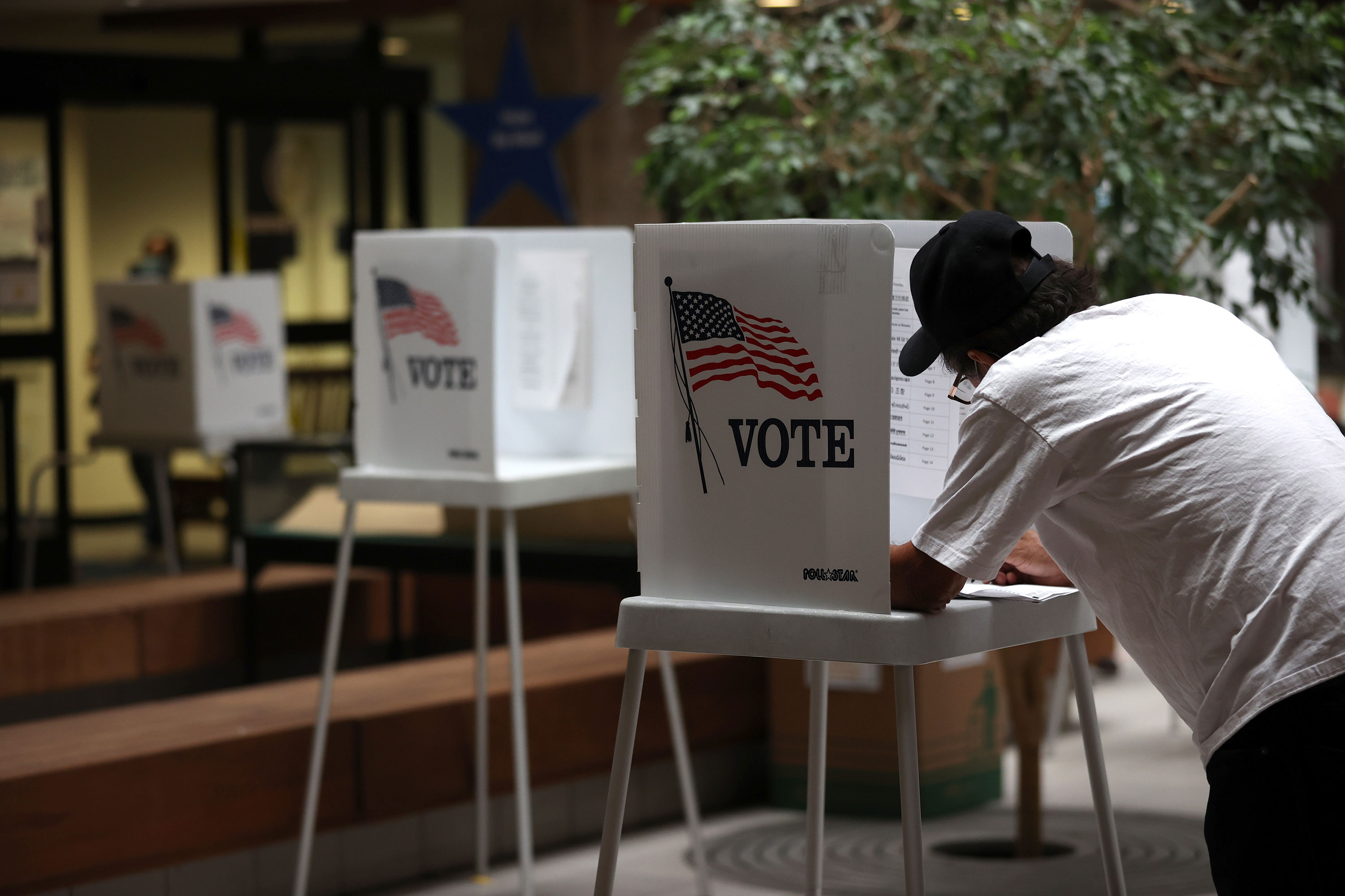 A voter fills out his ballot while early voting on October 13 in San Jose, California. 