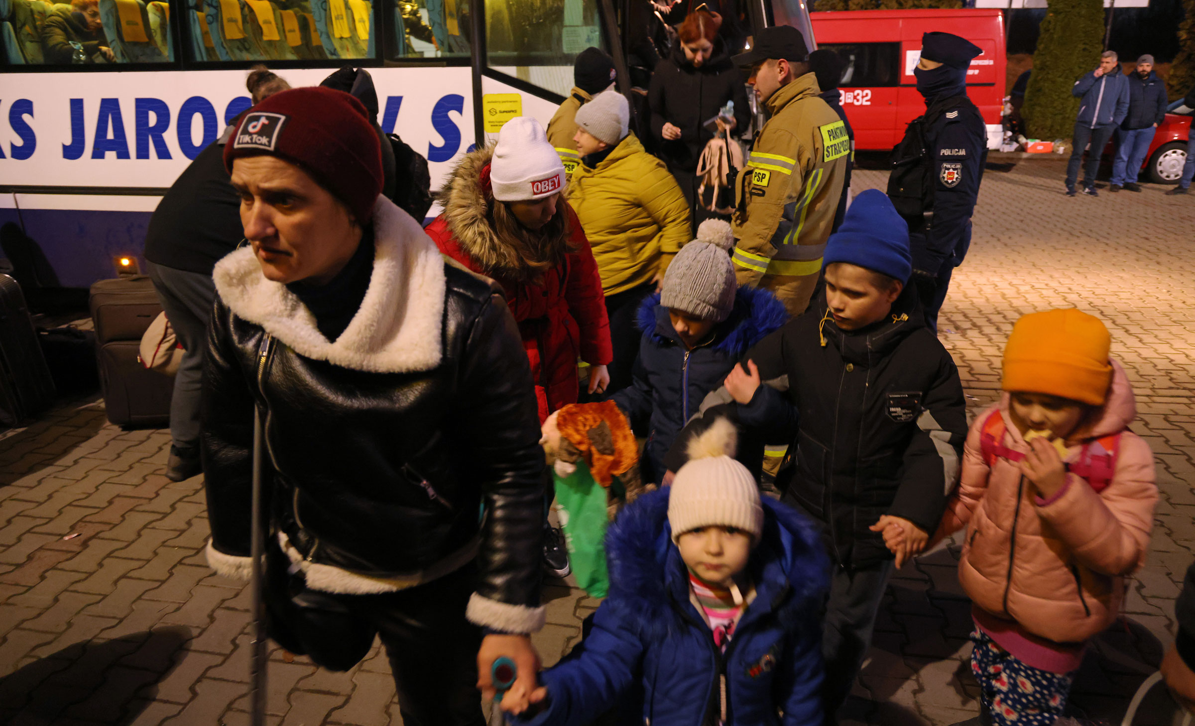 Refugees from Ukraine arrive at a temporary shelter near Korczowa, Poland, on Monday.