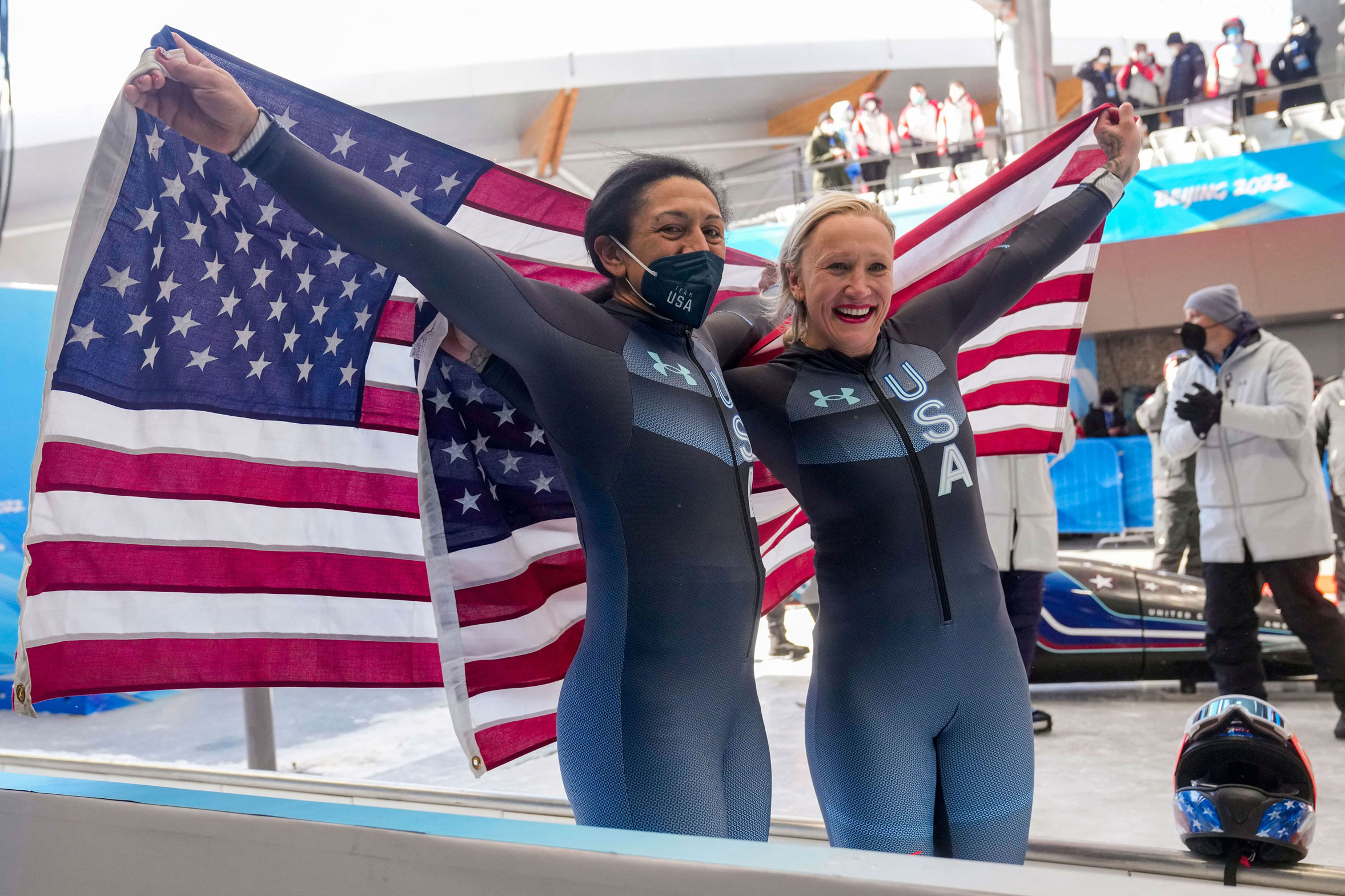 Kaillie Humphries (right) and her teammate Elana Meyers Taylor celebrate winning the gold and silver medals in the women's monobob on Monday.
