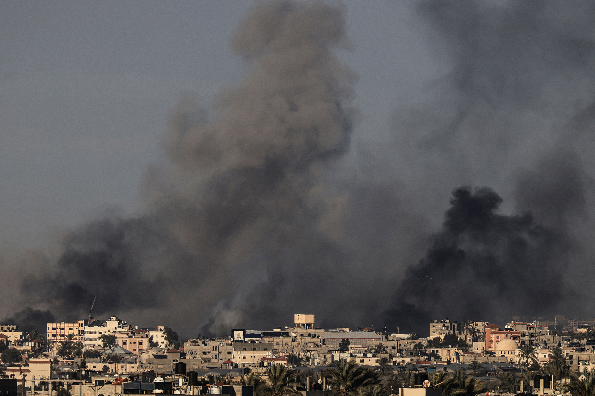 Smoke billows over Khan Younis in southern Gaza during Israeli bombardment on January 15.